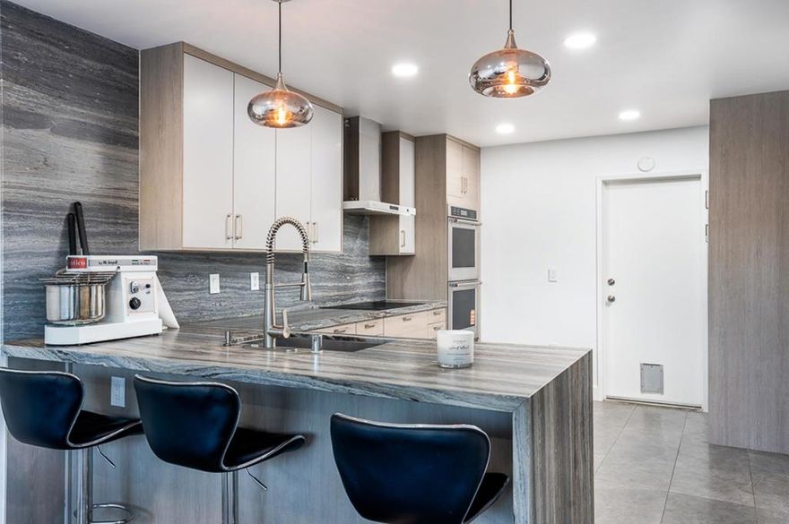 Well-priced and move-in ready, this 3-bedroom townhome with open greenbelt views is located in the desirable Carlsbad Palisades (92008). Double-door entry opens to a bright, functional living space with no homes directly behind, providing privacy and long-term view value.  The home offers significant recent upgrades that reduce future expenses, including dual-pane windows, a newer HVAC system, updated flooring throughout, refreshed bathrooms, and fresh interior paint. The kitchen has been updated with quartz countertops, upgraded cabinetry, quality appliances, and modern lighting, making it immediately usable without renovation.  The primary suite includes an updated glass-enclosed shower and vanity, while features such as a modern fireplace and Tesla charger add everyday practicality. The private patio opens to a quiet greenbelt—an uncommon benefit in this community.  Residents enjoy two pools, spas, and tennis/pickleball courts, providing strong amenities without sacrificing convenience. Located minutes from Carlsbad Village, beaches, shopping, dining, top-rated schools, and freeway access, this home delivers location, upgrades, and privacy at a competitive entry point into coastal Carlsbad.  A smart option for buyers focused on condition, location, and long-term value.