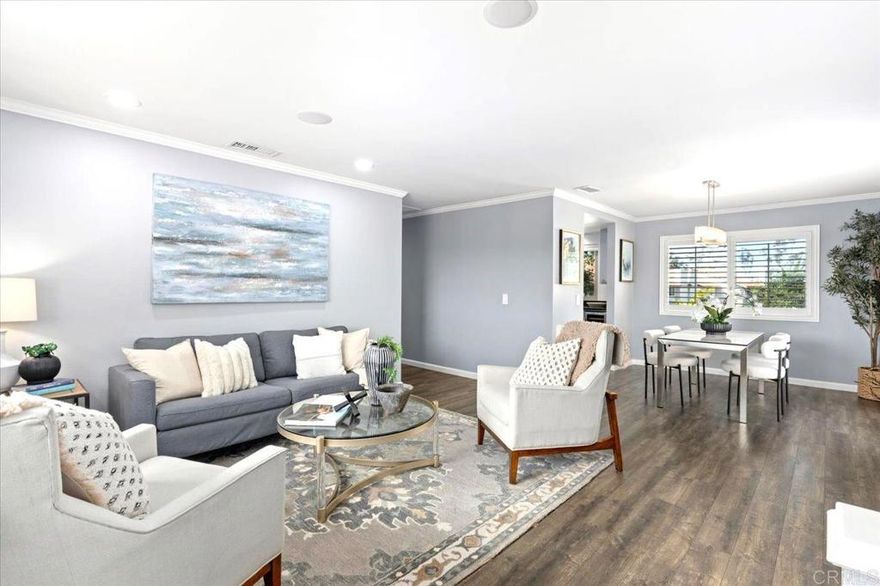 Beautifully Updated Townhome in La Costa! This light-filled 2-bedroom, 2-bath corner unit offers a thoughtfully designed floor plan that blends comfort, convenience, and style. The bright and airy living area features breathtaking mountain views and opens to a spacious balcony—perfect for entertaining or enjoying your morning coffee or evening glass of wine. The primary suite includes an ensuite bathroom and is large enough to accommodate a sitting area or home office setup, complete with built-in closets and custom shades.  The updated kitchen boasts sleek stainless steel appliances, a brand-new wine refrigerator, and ample storage. Additional upgrades include dual-pane windows and sliders with shutters, central air conditioning with a Honeywell Smart thermostat? and 2 sets of Bluetooth ceiling speakers. In-unit laundry closet with a full-size washer and dryer. Highlights continue with an attached one-car garage featuring newly finished epoxy flooring and extra storage space. Additional parking includes a reserved space and a private driveway. A newly remodeled 20’ x 5’ storage room beneath the property offers exceptional space for all your storage needs.  Residents enjoy resort-style amenities, including two sparkling pools, spas, barbecue area and tennis courts. Ideally located minutes from shopping, dining, beaches, golf courses, the library, movie theaters, Omni La Costa Resort, Bressi Ranch, Palomar Airport, and more. Within a highly rated school district, this home presents an outstanding opportunity to live in the desirable La Costa community.