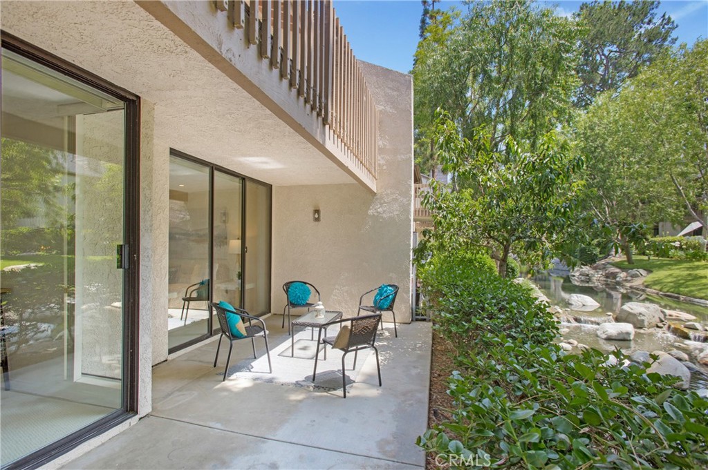Welcome home to your peaceful retreat nestled within the picturesque, storybook-like Quail Creek Community in the heart of Laguna Hills. This rarely available single-level, 2BD/2BA end unit offers an ideal blend of tranquility and convenience, thoughtfully designed with no steps and easy ground-floor access. From the moment you arrive, you’ll feel a sense of calm as gentle waterfall sounds from the creek behind your home create a soothing backdrop to everyday life. Light pours into every room, accentuating the fresh paint and brand-new carpet, creating a warm, inviting space ready for your personal touch. Unwind by the cozy fireplace in the living room as soft natural light filters in through sliding glass doors that open to a private patio perfect for coffee and connections in the morning or quiet evenings accompanied by the soft sound of water flow. The spacious primary bedroom also opens to the patio, offering a private oasis with an en-suite bath and peaceful views. The second bedroom, with its classic double-door feature, makes a wonderful guest space, home office or wellness room. A second full bathroom is conveniently located just across the hall. The kitchen blends vintage charm and functionality, featuring a character-rich original stove, a newer dishwasher and a lovely window view that captures the greenery outside. This home includes a refrigerator, washer and dryer, central air conditioning and two designated parking spaces, one covered and one open, with ample guest parking nearby. Quail Creek is more than just a neighborhood, it’s a sanctuary. A large pond, lush landscaping, graceful bridges and meandering creeks with ducks and turtles give this community its signature charm. Enjoy resort-style amenities including two sparkling pools, two hot tubs, relaxing saunas, two lighted tennis courts and EV charging stations. Tucked quietly in a prime location adjacent to Nellie Gail Ranch, this special South Orange County community feels like you're away from at all even when you're close to everything you need.