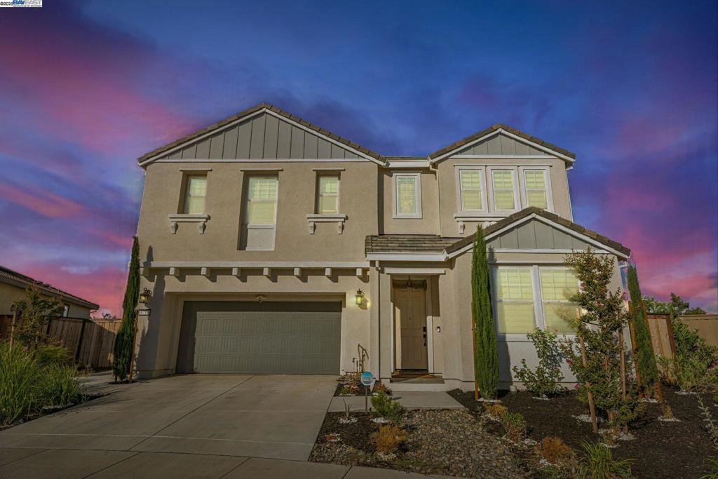 Step into this beautifully maintained home in the heart of Tracy Hills, showcasing the most sought-after floor plan designed for modern living. Perfectly positioned on a premium corner lot with no rear neighbors, it offers rare privacy and open views. Over $70K in premium upgrades include automated blinds for effortless light control and a whole-home water softener for added comfort. Inside, enjoy sun-filled open-concept living spaces, a gourmet chef’s kitchen, and a finished garage. A full bedroom and bath on the first floor make it ideal for guests or multi-generational living, while the upstairs primary suite delivers sweeping city-light views. The rare oversized backyard is perfect for entertaining or peaceful relaxation. This energy-efficient home features a fully paid solar system, low HOA fees, and sits within a top-rated school district. With its pristine condition, upgrades, and prime location near parks, trails, and freeway access, this is a move-in-ready gem you won’t want to miss!