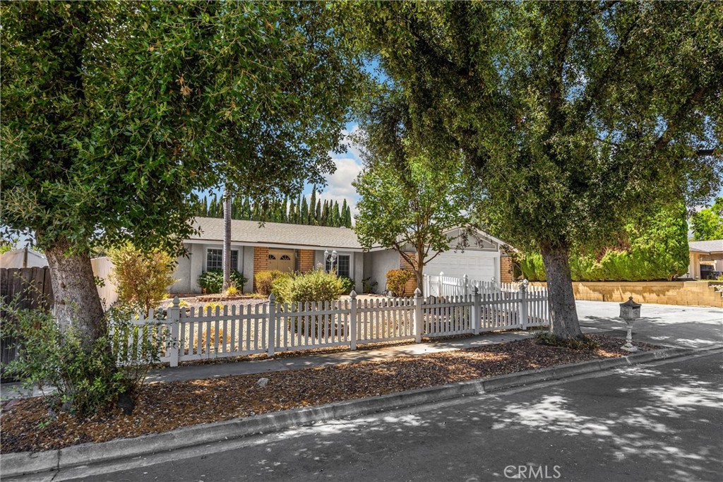 Welcome to this charming single-story home located on a quiet cul-de-sac in the heart of Alta Loma! Featuring 4 spacious bedrooms and 2 bathrooms, this beautifully maintained residence offers comfortable and versatile living for any lifestyle. Enjoy a bright, inviting interior with thoughtful updatesStep through the double-door entry into a warm and inviting living room with a cozy fireplace, durable laminate flooring, and stylish French doors for added privacy.
The kitchen boasts stainless steel appliances, ample cabinetry, and a convenient breakfast bar that opens to a large dining area/family room—ideal for everyday living and entertaining.
The spacious primary suite includes its own private bathroom, while three additional bedrooms provide flexibility for guests, a home office, or hobbies.
Enjoy the generous backyard with a covered patio and endless potential for a garden, play area, or future pool.
This Alta Loma gem combines classic charm with modern upgrades and is ideally located near shopping, dining, schools, and with easy access to the 210 freeway.