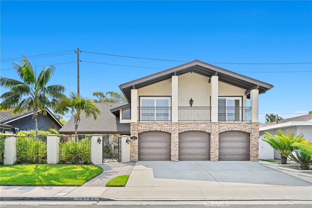 Welcome to 19702 Quiet Bay Lane, nestled in the heart of Huntington Beach’s highly sought-after Lower SeaCliff community. This home is located less than a mile from the ocean and enjoys close proximity to The Huntington Club—with golf course views from the upstairs bonus room. Offering a versatile and desirable floor plan, this home includes a convenient downstairs bedroom and full bath, along with a spacious second-level bonus room perfect for a home theater, game room, or work-from-home setup. As you step through the front gate, you're greeted by a welcoming front patio, ideal for enjoying your morning coffee with ocean breezes. Inside, the formal living room flows seamlessly into the dining area, creating a perfect space for entertaining. The chef’s kitchen features a large center island with a built-in wine fridge, premium KitchenAid appliances, and opens to a cozy family room with a fireplace. Upstairs, the massive bonus room offers incredible natural light and direct views of the golf course. Two guest bedrooms share a full bath with dual sinks, while the spacious primary suite has its own fireplace and an ensuite bath with dual vanities, a soaking tub, walk-in shower, and generous closet space. The backyard is a true coastal retreat, complete with a spa and water feature, built-in BBQ, fire pit, and a large covered patio—ideal for entertaining or relaxing while enjoying coastal Orange County weather. Located in one of the most prestigious neighborhoods in Huntington Beach with access to excellent schools, this home offers the best of coastal living in a peaceful, private setting.