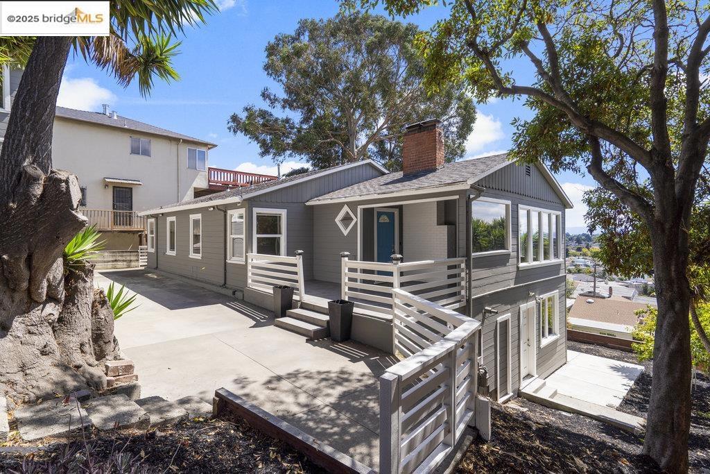 Welcome to 9949 Lawlor Street, a hillside retreat in Oakland’s coveted Toler Heights neighborhood, where sweeping views of the San Francisco skyline and Bay set the scene. Fully renovated in 2017, this home offers a versatile layout with light pouring through a wall of windows in the living and dining rooms. The updated kitchen features quartz countertops, stainless steel appliances, and ample storage. The spacious primary suite includes a double vanity, a walk-in shower built for two, and generous closet space. A fourth bedroom with private entrance is ideal for guests, a home office, or a creative studio. Outdoor living shines with a terraced backyard, expansive deck for sunset watching, and a front courtyard that’s a gardener’s delight. Fresh interior and exterior paint enhance its move-in-ready appeal. A detached two-car garage with unfinished storage or workshop space beneath adds functionality.* Enjoy nearby trails, the Oakland Zoo, and easy access to freeways for a quick commute to San Francisco or the East Bay’s many attractions. *Buyer to investigate. Views: Downtown