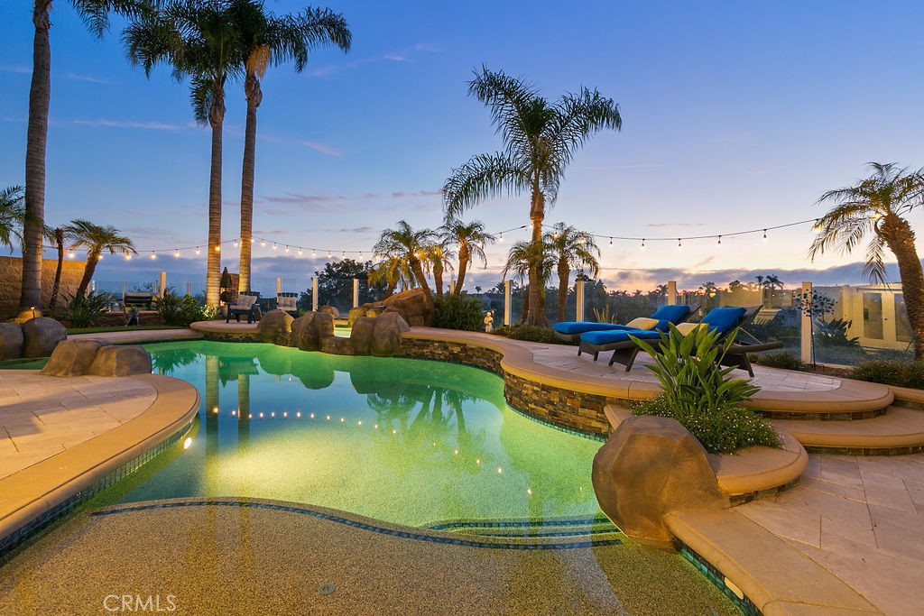 Available December 12th! This FURNISHED home offers breathtaking ocean views that will leave you in awe. Nestled in the highly sought-after San Marin community, this home boasts 5 bedrooms, 3 full bathrooms, and endless upgrades throughout! As you step inside, you'll be greeted by beautiful hardwood flooring and high, beamed ceilings, creating a warm and inviting atmosphere. The walls have been removed to create a seamless open concept between the gourmet chef's kitchen, the family room, and the formal dining room. The kitchen is a culinary enthusiast's dream, equipped with high-end stainless appliances, a built-in refrigerator, custom cabinetry, and a spacious working island with exquisite stone countertops. Plus, an additional wine/drink fridge is built into the family room for your entertainment needs. The property offers stunning ocean views from both levels, allowing you to enjoy mesmerizing sunsets and the serene beauty of the sea. Step outside into the resort-like yard, where you'll find an oversized, sparkling pool and spa, perfect for relaxation and enjoyment. Host outdoor gatherings at the built-in BBQ island and bar, gather around the cozy fire pit, or unwind in the quiet sitting area surrounded by landscaping that adds to the tranquility of the space. With 5 bedrooms and 3 remodeled bathrooms, including a lower-level office/guest bedroom with a custom Murphy bed. The upstairs primary bedroom features a king-sized bed, a large balcony with gorgeous ocean views, and a large ensuite with tiled shower, soaking tub, separate water closet, and a large walk-in closet. Two more guest rooms feature queen-sized beds with one bedroom enjoying its very own private balcony. A large third upstairs guest room is a perfect kids room that includes a twin-sized trundle bed, a low-height table, and desk. Located at the end of a quiet cul-de-sac on a single loaded street, this home provides plenty of parking and a peaceful atmosphere. San Marin is conveniently situated approximately a mile away from world-renowned beaches, trolley access, 5-star resorts, and beautiful beach trails. Experience the epitome of private, resort-style living in this furnished home. Your coastal oasis awaits! Rate varies based on length of term and time of year: $12,500 for 3-11 month lease, June, July, and August or less than 3 months are $14,000 per month.