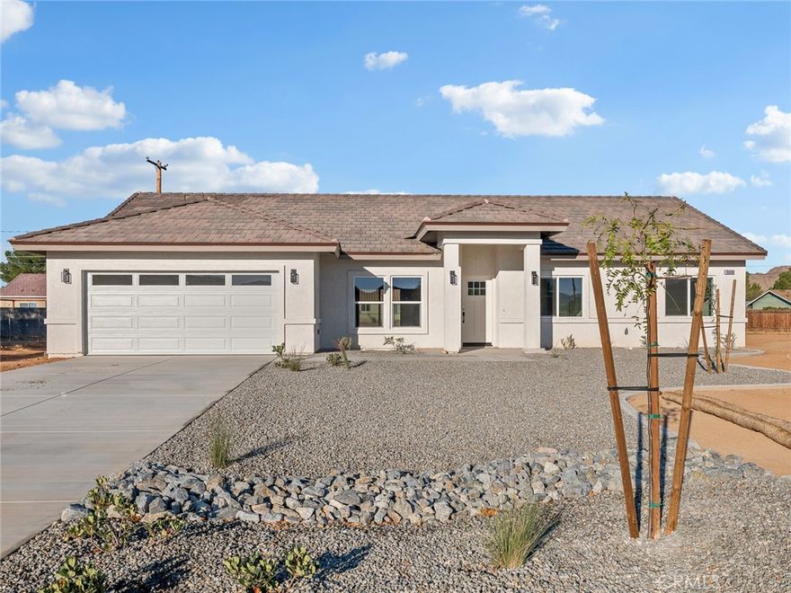 Welcome to your dream home! This stunning, brand new construction 4-bedroom, 2-bathroom residence offers modern living at its finest in one of the areas most desirable neighborhoods.  Thoughtfully designed with style and sustainability in mind, this home features paid-off solar, helping you save energy costs from day one!  Step inside to find a bright, open-concept layout with high ceilings and custom finishes throughout.  The gourmet kitchen is a true showstopper boasting quartz countertops, sleek cabinetry, a large center island, perfect for entertaining.  The spacious primary suite offers a retreat with a beautifully designed en-suite bathroom and ample closet space.  Three additional bedrooms provide flexibility for a growing family, home office, or guest rooms.  Outside enjoy low maintenance landscaping and a private backyard.  Don't miss your chance to own this energy-efficient move-in-ready gem!  Schedule your showing today!!!