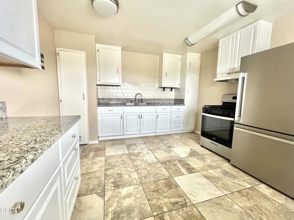 .** L A City Section 8 voucher holders are welcome to apply ** Enjoy this recently upgraded, upstairs two-bedroom apartment of a triplex in San Pedro with a view of the Vincent Thomas Bridge and the Terminal Island ports.The newly remodeled kitchen provides granite countertops, abundant wall, and base cabinet storage, as well as pull-out drawers, two six-foot-tall pantries, a dual stainless steel sink, a gas stove with a control board, brand new refrigerator with glass shelving and a pull-out bottom freezer, ceramic tile flooring and more! There is an eat-in area of the kitchen with an east-facing window providing shipping port views, as well as the living room window. Carpeted living room and bedrooms. Wood faux blinds in all windows. Matching flush mount ceiling fans in both bedrooms. The bathroom provides a shower over the bathtub, tiled shower walls, and a new toilet. There are separated full-size washer and dryer hook-ups for your own machines. There is one off-street parking space provided. This is a non-smoking / no-pet property.