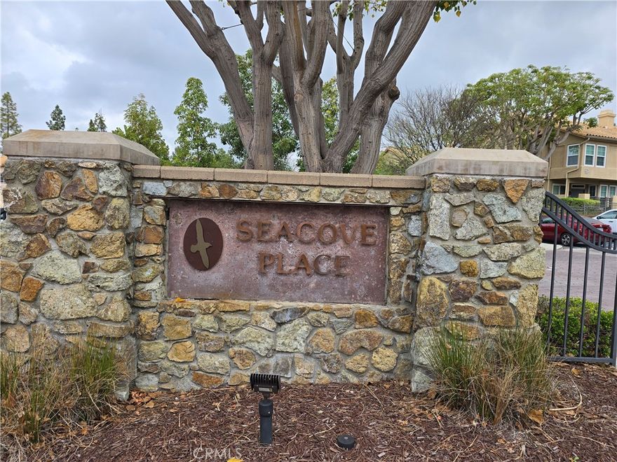 Seacove Place: 3 Bedrooms 3 Full Bath Attached Townhouse, Kitchen with Maple Wood Cabinets, Breakfast Bar, Black Appliances, Stove, Dishwasher, Microwave Hood, Separate Dining with Ceiling Fan, Recessed Lighting, Vinyl Planking Downstairs, and Carpet upstairs, Gas Burning Fireplace with Mantel, Livingroom with 20ft Ceilings, 2in Faux Wood Blinds, All Bedrooms with Ceiling Fans, Light Fixtures, Master Bedroom with Walk in Closet, Mirror Closet Doors, Patio Off Livingroom, Laundry Hook-up’s, Single Attached Garage with Opener, 1 Extra Assigned Parking Space, Community Pool, Spa, Clubhouse, Near Coyote Park and Aliso Viejo Country Club. (Note: 1 Bedroom and 1 Full Bath Downstairs)