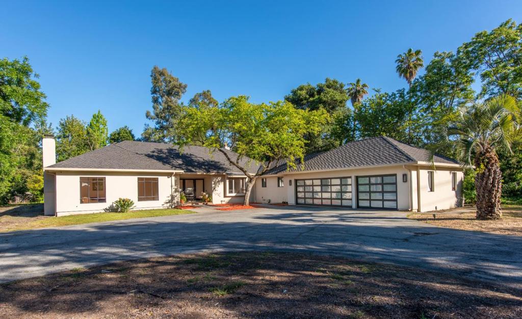 Welcome to this 4 Bedroom 3.5 bath home located in Central Atherton. Short distance to downtown Menlo Park. This home has an abundance of natural light through many skylights. Some of the many features include formal living room with gas fireplace, kitchen with granite counter tops, new appliances and a wine refrigerator for over 167 bottles. Large master suite with a state of the art bathroom. Family room opens to the garden and pool, it has 78 TV with 4K and built in audio speakers, fireplace and built in cabinets. 4th bedroom has custom built in cabinet and closets it is currently being used as an office. Travertine floors and hardwood maple floors throughout. House was repainted inside and stucco outside. In late 2014 the owner remodeled 75% of the house.The owner opted to remove the 5th bedroom and made the garage into a 3 car garage and built 1 lift in order to be able to park 4 cars.