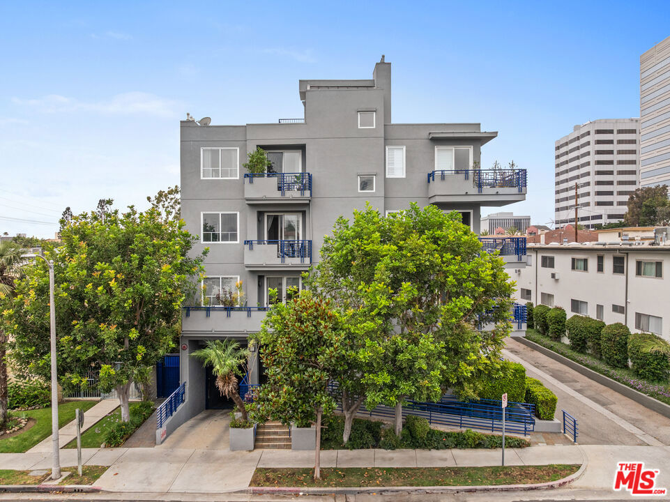 Discover this spacious and sophisticated 2 bedroom, 2 bathroom condo tucked on a quiet, tree-lined street in one of West LA's most desirable pockets, just minutes from both Santa Monica and Brentwood. The smart, single-level layout offers ideal separation between the two bedrooms, with the primary and guest rooms located on opposite ends perfect for privacy, hosting guests, or shared living. The open-concept living and dining area features laminate wood flooring, a cozy gas fireplace, and access to an expansive patio area for entertaining or relaxing. The kitchen is equipped with granite countertops, stainless steel appliances, and generous cabinet space. The primary suite includes a large walk-in closet and a spa-like bathroom with dual vanities, a soaking tub, and separate shower. The guest bedroom features a custom closet and easy access to the second full bathroom. Additional highlights include in-unit side-by-side laundry, central heat and air conditioning, and two gated parking spaces. The well-maintained 12-unit building also offers secure entry, guest parking, and a 3'4" x 5'10" private storage. HOA dues include water, trash, sewer, and earthquake insurance. The building is walking distance to Wilshire and Santa Monica Blvd, near top restaurants, shops, cafes, parks, and the Expo Line, this one checks all the boxes for prime Westside living.