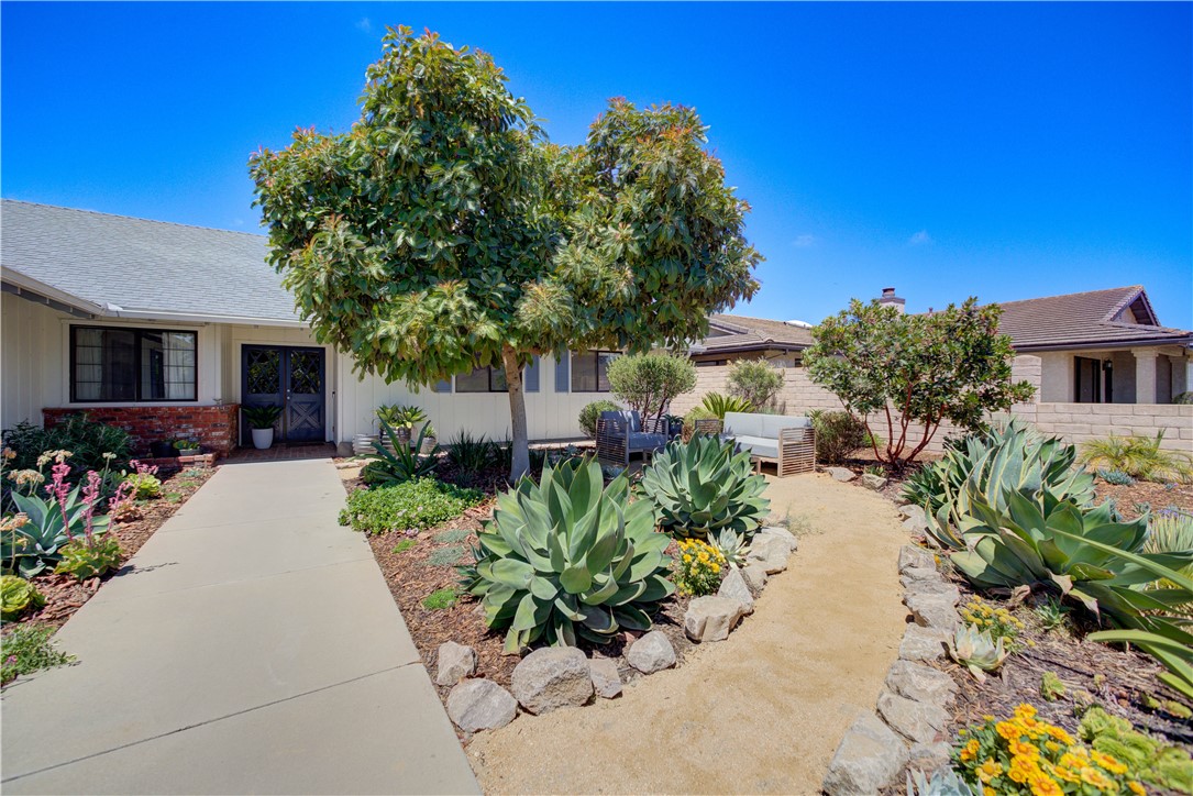 Located in the heart of Pioneer Village – one of Santa Maria’s most established and sought-after neighborhoods – 1629 Hillsboro offers single-level living with space to stretch out. This 3 bed, 2.5 bath home includes multiple living and dining areas, a dedicated indoor laundry room, plus a permitted sunroom that adds a generous bonus space for game nights, dinner parties, a second living area, or craft room. The kitchen features a breakfast bar and informal dining nook, while the oversized open-concept living space allows flexibility for a formal dining setup. Vaulted ceilings, a brick fireplace, built-in cabinetry, and fresh interior paint give the home character and warmth. The backyard has a lemon and orange tree, a patio for BBQs, and a massive, paved side yard—ideal for RV, boat, or toy storage. The front yard is a showstopper – landscaped with succulents and vibrant blooms of purple, pink, yellow, and cheerful orange. A thriving avocado tree anchors the space, shading a peaceful sitting area where you’ll soak in the sunshine, the coastal breeze, and the quiet rhythm of life in one of Santa Maria’s most treasured neighborhoods. Just minutes from Marian Hospital, the 101 freeway, shopping and amenities, this home is the perfect blend of comfort and convenience.