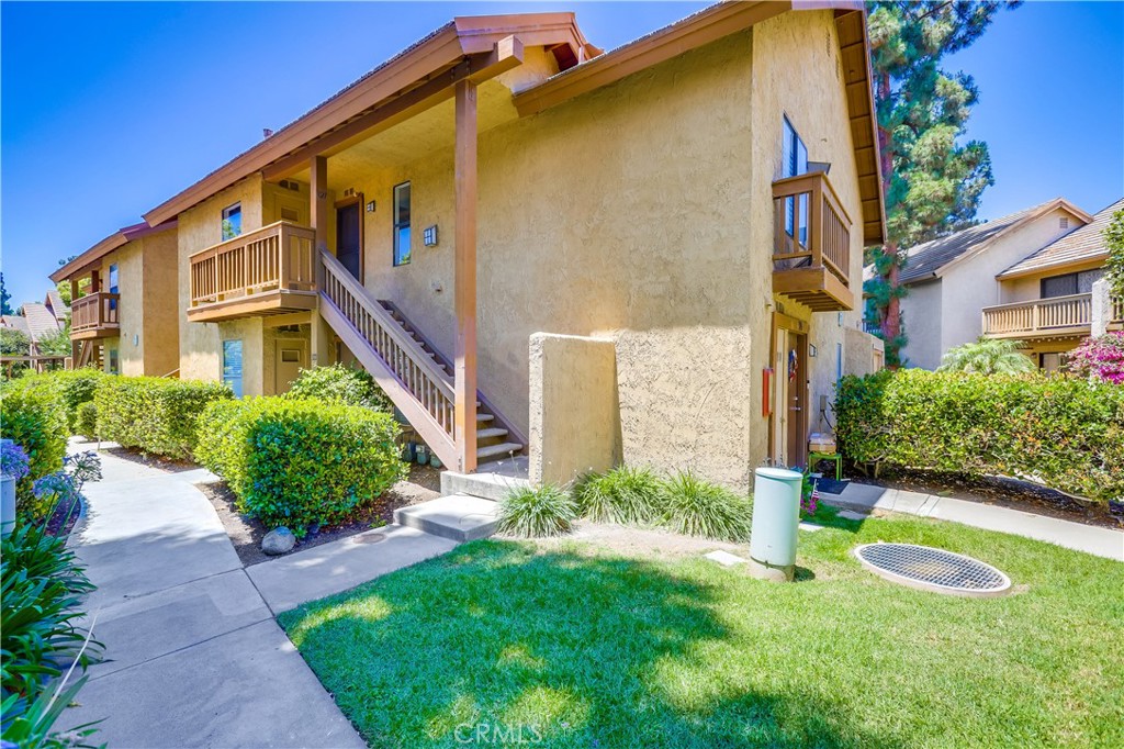 Beautifully remodeled upper-level unit boasting dazzling improvements throughout, everything new new new!!! Located in the desirable Lake Condos community at Orangetree, superbly situated just a few steps from the clubhouse, pool, tennis/pickleball courts, and boasting soothing balcony views of the bubbling pond and meandering streams, you will adore this location! Step inside and soak in the newly remodeled, freshly painted, light filled interior, blessed with an open concept floor plan, gorgeous new luxury vinyl plank floors throughout, new AC Condenser, and new custom lighting setting the stage for the perfect living environment. The living area has soaring vaulted ceilings and direct access to the private balcony overlooking the tranquil community pond and greenbelt creating an ideal indoor-outdoor living space for relaxing and with loved ones. The dining area is open to both the living room and the kitchen, providing an excellent space for entertaining. The exquisite new kitchen has been beautifully redesigned with elegant new Quartz countertops, timeless white Shaker cabinetry, new hardware and pulls, glistening subway tile backsplash, new faucet and undermount sink, new stainless-steel appliances, and a prized breakfast bar. Upstairs includes a fully enclosed bonus loft space which has a new door and closet space, vaulted ceilings, attic access, recessed lighting, and windows overlooking the living room, perfect for an executive home office, den, or 2nd bedroom. The primary bedroom on the main level includes mirrored closet doors and recessed lighting. You will fall in love with the amazing new bathroom with custom Quartz topped vanity, new faucets and fixtures, framed vanity mirror, and a gorgeous custom tiled step-in shower enclosure. This unit also boasts a dedicated laundry nook for stackable washer and dryer; plus ample storage provided in the built-in linen cupboards. This unit includes 1 dedicated assigned carport space, #166, conveniently located nearby. Community amenities include lush green spaces and walking paths, tranquil ponds and meandering streams, 2 community pools and 2 spas, Clubhouse, lighted Tennis, Pickleball, and Basketball courts, and playground. Excellent Irvine location just steps from Oak Creek Golf Club, Oak Creek Community Park, and Irvine Valley College. Close to shopping, entertainment, and dining at nearby Irvine Spectrum and Alton Square. Just minutes from Fashion Island, Newport Beach, and Corona Del Mar.