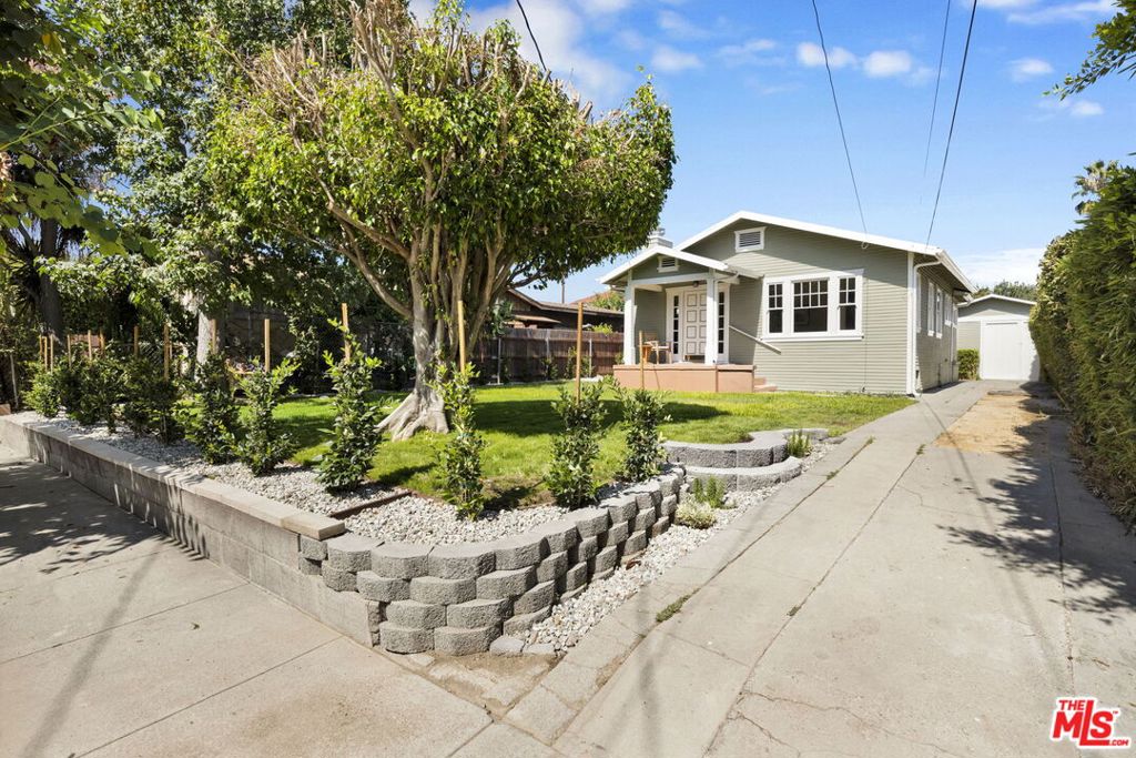 The FrogTown Bungalow ******** Welcome to classic Craftsman charm in Elysian Valley's Frogtown neighborhood. Step into this beautiful home, thoughtfully reimagined for modern living. Nestled on the desirable West bank of the Los Angeles River, this 1925 Craftsman residence has been delicately restored to bring out the luster and character of its exterior, while its remodeled interior creates a welcoming energy with all the modern comforts, a perfect blend of this home's original architectural charm with intentional contemporary upgrades. Step inside to brand-new flooring, premium lighting and hardware, and a layout that flows seamlessly from room to room. The bright kitchen anchors the home with generous stone countertops, stainless steel appliances, ample cabinetry, and a cozy breakfast nook perfect for both everyday living and entertaining. Two bedrooms are complemented by a versatile bonus space ideal for a home office or oversized closet. You'll find recessed lighting throughout the home, accompanied by sleek premium hardware and fixtures to complement each space. Outside, privacy hedges surround multiple outdoor zones, including lush lawns in the front and back, a welcoming front patio, and a long driveway that extends to a one-car garage. The detached garage offers potential for an ADU, studio, or home-gym. This lot is also zoned R2, opening even more possibilities. ******** This is truly a special neighborhood, steps from the Elysian Valley bike path and just blocks from beloved local cafes, restaurants, and parks. With Atwater Village minutes away in one direction and Silver Lake, Echo Park, and Dodger Stadium in the other, you're at the heart of one of LA's most vibrant pockets. This special home is your opportunity to own a slice of Los Angeles' architectural legacy modernized with purpose and style. ******** Broker & Broker's agents do not represent or guarantee the accuracy of the sqft, bedroom/bathroom count, lot size, dimensions, or other information concerning the conditions or features of the property. Buyer is advised to independently verify the accuracy of all information through personal inspection and with appropriate professionals to satisfy themselves and rely only on that.