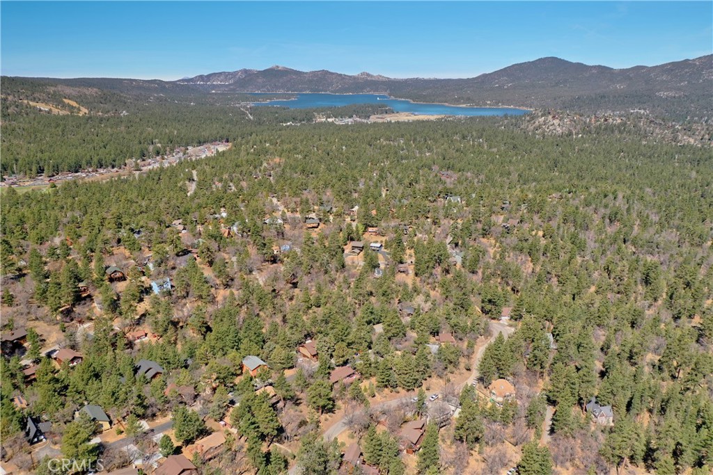 Build Your Dream Mountain Lodge in Moonridge! Situated in an Enchanting Neighborhood with Gorgeous Views. A Gentle Downslope and 60 feet of Street Frontage lends to an Easy Build with Great Access and Parking. Immerse Yourself in Beautiful Trees, Blue Sky during the Day and Stunning Stars at Night, Crisp Mountain and Air Endless Ridgeline Views! Enjoy the Precious Nature while the Birds Chirp and Soar, Deer and Bear Meander Through, Delicate Butterflies Flutter. This is a Peaceful Community with a Profound Appreciation for The Mountains. Located in Moonridge with excellent Proximity to the best Big Bear has to offer, including Ski Slopes at Bear Mountain, Alpine Zoo, Bear Mountain Golf Course, Hiking Trails and Awesome Dining and Shopping options. Experience this Four Season Mountain Resort Community with Everlasting Beauty and Where the Fun Never Ends! Watch a Video of the Area Now! https://www.youtube.com/watch?v=M1aNtPX0sww