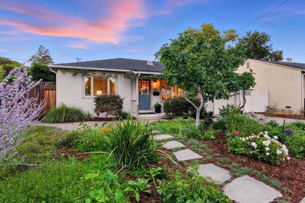 Welcome to this delightful 3-bedroom, 1-bath garden retreat in the heart of Mountain View. The home sits on a quiet street and offers a rare blend of indoor comfort and outdoor beauty. Enjoy a wisteria-covered deck area, mature fruit trees including apple, fig, kiwi, persimmon, plum, orange, and pear, plus a charming grapevine that graces the front of the home with natural character. The generous yard provides potential for expansion. Inside features refinished hardwood floors, granite countertops, fresh paint, and a tankless water heater. A detached bonus space offers added versatility. Minutes from tech campuses, Castro Street, and top-rated schools: Bubb Elementary, Graham Middle, and Mountain View High. Don't miss this gem schedule your private tour today!