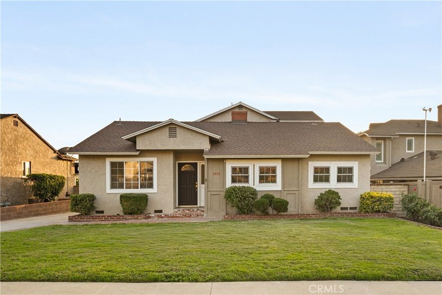 Nestled on a peaceful, tree-lined street in the coveted Burbank foothills, this timeless Ben Mar residence blends classic California charm with thoughtful modern updates. Lovingly maintained and upgraded over five decades, this four-bedroom, two-bath home radiates warmth and comfort from the moment you arrive. Inside, natural light pours across wide-plank wood floors, guiding you through the connected living and dining room—each designed for effortless flow and everyday gathering. A stately fireplace anchors the living space, complemented by curated modern finishes and serene mountain views through expansive windows. The reimagined kitchen is a showpiece of functionality and design, featuring shaker cabinetry, quartz counters, brass hardware, and stainless steel appliances. A cozy breakfast nook captures morning sunlight and frames picturesque foothill views. Upstairs, the primary suite feels like a private retreat beneath soaring wood-beam ceilings. Unique stained-glass windows add character, while the updated ensuite bath dazzles with marble-style tile, a walk-in rain shower, and elegant brass accents. Step out to your private balcony and enjoy sweeping sunset views over the valley. The backyard is perfect for entertaining, complete with a spacious covered patio, built-in BBQ kitchen, and lush surroundings ideal for alfresco dining. Recent upgrades include a new roof, copper plumbing, vinyl and aluminum windows, and central air and heat for year-round comfort. Located moments from hiking trails, top-rated schools, and the heart of Burbank’s dining and entertainment scene, 1819 Richard Street offers the best of foothill living—classic, comfortable, and beautifully renewed.