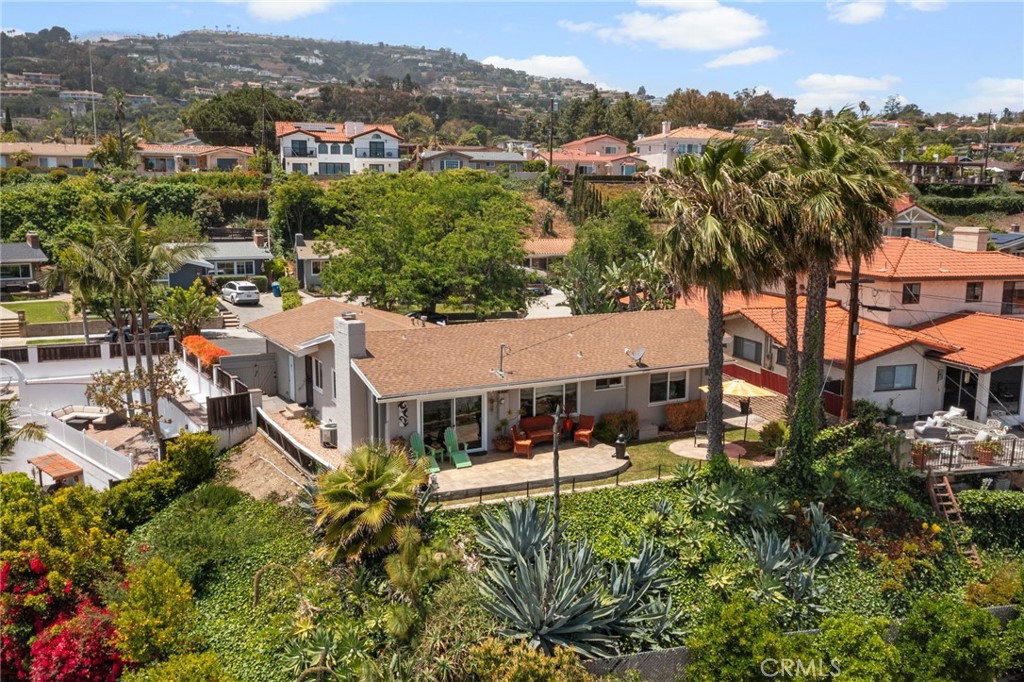 Welcome to 216 N Goodhope — where San Pedro’s coastal charm meets modern luxury.
Perched above the harbor with sweeping ocean and harbor views, this residence captures everything we love about San Pedro living. Designed with an airy, open-concept floor plan, the home is bathed in natural light, creating a warm and inviting atmosphere from the moment you enter.
Enter onto the expansive patio and take in panoramic views of the Pacific and the bustling Port of Los Angeles — the perfect backdrop for morning coffee, sunset cocktails, or weekend entertaining. The coastal breeze and crown-molded interiors flow seamlessly together, creating an effortless blend of elegance and relaxation.
A Kitchen Made for Gatherings: The open kitchen is designed for both functionality and connection — with generous storage, under-cabinet lighting, and room for family and friends to gather while meals are prepared. The adjacent dining and living areas sit atop beautifully preserved original hardwood floors, balancing timeless craftsmanship with modern comfort.
Retreats That Inspire: The primary suite offers private poolside access through sliding glass doors, creating a serene retreat just steps from the water. A thoughtfully designed guest suite invites friends and family to enjoy sweeping sunset views, complete with its own private bath. Every room captures the unique coastal light that makes this home so special. The third bedroom was opened up to expand the Livingroom, but can be returned with a single wall.
Poolside Luxury & Secure Privacy: Behind the front entry gate, a sparkling pool provides a refreshing escape that’s both beautiful and easy to maintain. The secure garage includes laundry facilities and enclosed parking, ensuring peace of mind along with convenience.
Location That Matters: Set within a friendly, well-kept neighborhood and close to highly regarded schools, this home offers the best of both worlds — a private coastal retreat with the amenities of city living just minutes away.
216 N Goodhope is more than a home — it’s a lifestyle. Rarely does a property with this combination of modern design, timeless details, and breathtaking views come on the market in San Pedro. Don’t miss your chance to call it yours.