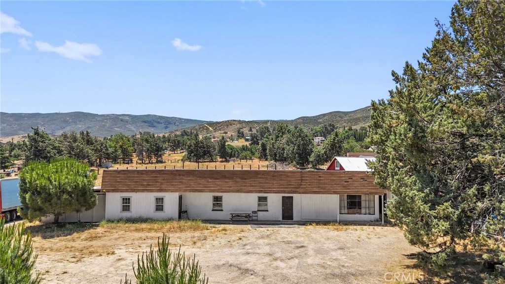 Ranch-style home on over 3.5 acres in peaceful Leona Valley! Great opportunity to own a versatile property in quiet and scenic Leona Valley. This 3 bedroom, 2 bathroom home sits on a 3.567-acre lot and offers around 1,610 sqft of living space. The home features new flooring, fresh paint, an updated kitchen with new countertops and stainless-steel appliances, recessed lighting throughout, and tile flooring in the bathrooms. Major system upgrades include a 200 AMP electrical panel with new wiring, an updated water main from the house to the street, interior copper and PEX water lines, and a newer septic system with leach lines. Outside, the property includes a 2 car detached garage, 1,500 sqft metal barn with A/C, water connections, and a 200 AMP panel, a 160' x 120' horse corral with shelter, a 120' x 90' corral with two shelters, a foaling pen, hay storage, a 2,500-gallon water tank, a 300 sq ft wood storage structure, and a separate 20' x 20' storage building. Whether you’re raising animals, working on projects, or simply looking for room to breathe, this property offers endless possibilities in a peaceful rural setting just minutes from town.