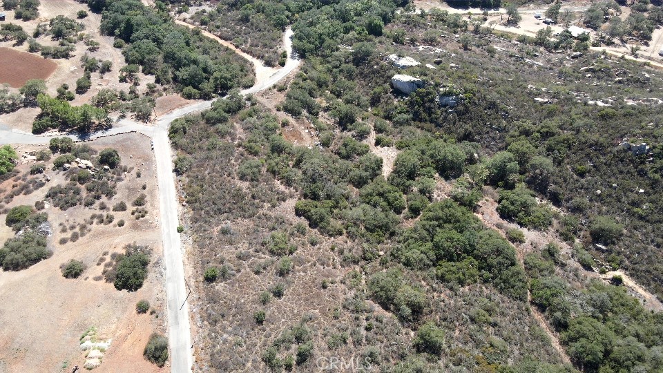 Almost 14 acres on paved Rancho Heights Road. Rancho Heights is a private gated community with lush green land, streams, and boulders for the outdoor person in you. It's off-grid, yet seven minutes outside Temecula in San Diego County. Grow crops, or build with utilities at the street.