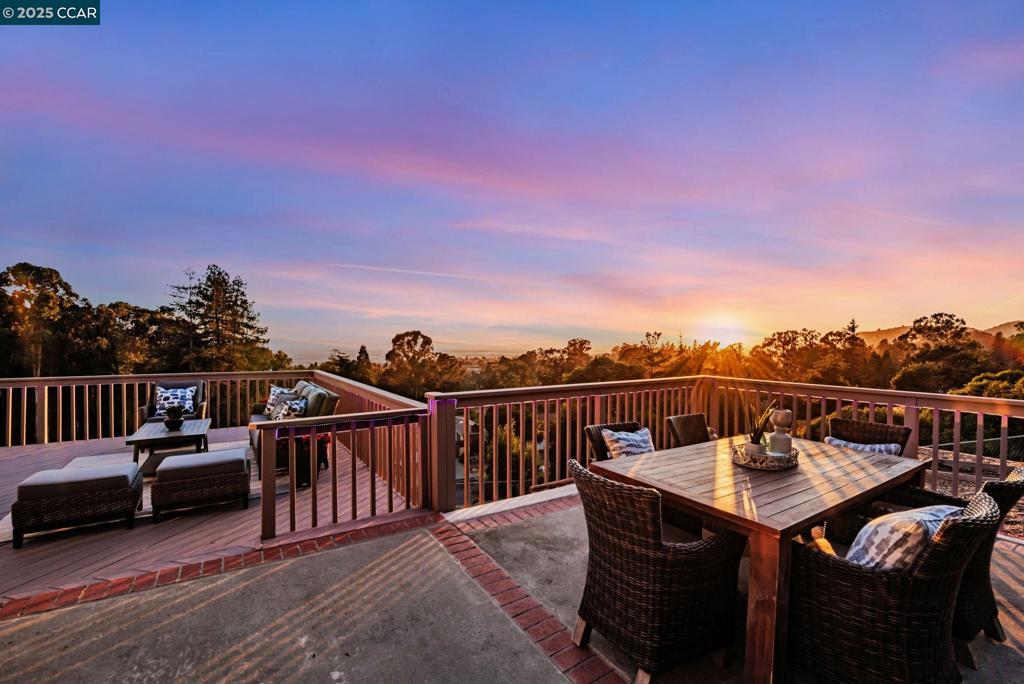 Perched above the prestigious Sequoia Country Club in Sequoyah Heights, this updated single-level private retreat offers sweeping panoramic views of the San Francisco skyline and Bay from almost every room. Set on over 1.2 private acres (no HOA), the low-maintenance grounds provide a serene home framed by mature landscaping and a level lawn, delivering ultimate privacy. Expanded for entertaining, the home features a spacious kitchen with an oversized quartz island, new stainless-steel appliances with abundant storage, flowing seamlessly into the dining room and two newly renovated four-season rooms that add over 500 sq ft of versatile living space designed for year-round entertainment, wellness studio, or private creative space. The home offers three bedrooms, including an owner’s suite with his and hers closets and ensuite bath. Step outside to an expansive redwood deck and dining patio, perfect for hosting gatherings where breathtaking sunsets create an unforgettable backdrop. The garage and private 300-foot driveway provide abundant off-street parking, making entertaining effortless. Near renowned Bishop O’Dowd High School, Anthony Chabot Equestrian Center, and the vibrant Oakland Hills, this home delivers an elevated, private lifestyle with spectacular views. Book your tour!