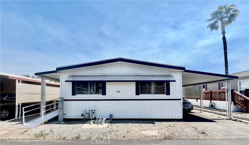 PRICED TO SELL! Desired London Spires MH Estates 55+ Senior Community Management Approval Required. Great Location & Curb Appeal Short Walk To The Clubhouse. Featuring Handicap Ramp To The Front Door For Easy Access. Covered Carport With Room For Two Cars And Access To The Side Door For Easy Loading And Unloading. Manufactured Home Golden West Espirit 1972 2 Bedrooms 2 Bathrooms Approx 1152 Sq Ft. Large Living Room With Evaporative Cooler & Dining Room With Built-In Hutch. Kitchen With Natural Gas Cook Top, Double Oven, Dishwasher, Garbage Disposal & Washer & Dryer Included. Separate Family Room Or Den Currently Used As An Office. Master Bedroom With Ceiling Fan, Mirrored Wardrobe Closet Doors And Wall Window A/C Unit. Master Bathroom has A Step-In Shower Stall & Vanity Sink. Guest Bedroom Has Walk-In Closet. Guest Bathroom Has Shower/Tub Combo And Vanity Sink. London Spires Offers Several Amenities & Activities To Choose From Including A Clubhouse, Pool & Spa, Exercise Room, Library, Billiards & BBQ Area Great Area To Gather With Family, Friends & Neighbors! Low Land Lease Base Of $687.00 X Month And Metered Utilities Water, Sewer & Trash. Retirement At It's Finest!