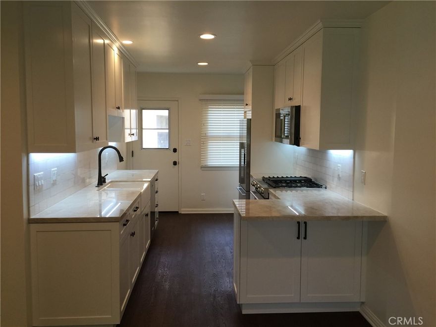 Ultra high-end, remodeled, open floor plan Sunset Park apartment with patio, private laundry room, storage and central heating and air conditioning. Your own private 1-car garage enclosed parking with additional storage and automatic garage door opener. Completely renovated open concept in designer venetian bronze Tuscan/contemporary style. Quartzite countertop in the kitchen with Thassos white marble subway tile backsplash. Breakfast bar. Kitchen under counter LED lighting. Custom self-closing wood cabinets.  Recessed lighting. Granite countertop in the bathroom. All travertine tile in bathroom and shower. Rimless glass shower with travertine shower bench and split face accent. Hardwood floors throughout. High-end stainless steel appliances included. Great for a chef includes dishwasher, refrigerator with water and ice maker, microwave, stove, disposal, farmhouse kitchen sink, etc. Beautiful wooden shutters for added privacy. Electrical sockets with dimmers. Front and back door. Your own private laundry room with utility sink and additional spacious storage for surfboards or bicycles. Unit is like a private home. Ride your bike to the beach and Main Street. Centrally located to Westwood, Beverly Hills, and Venice. Enjoy the ocean breeze.