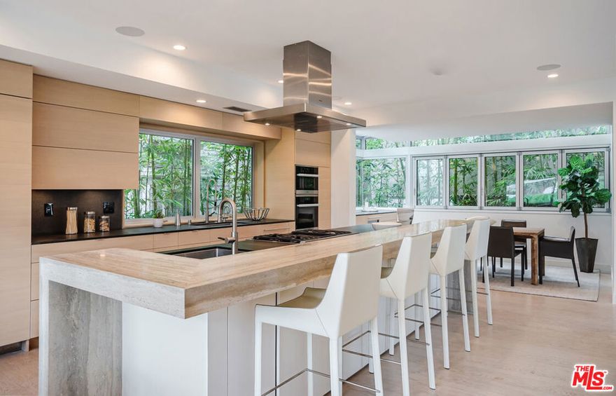 Furnished 4-bed, 4-bath lease available NOW through May 31, 2026. With 3,047 sq. ft., this Manhattan Beach walk-street home is just steps from the sand, downtown, and the greenbelt. Designed by Dean Nota and remodeled by Silicon Bay in 2018, the home feels like new with modern sophistication and coastal warmth. The first floor includes a family room with polished concrete floors, custom built-ins, and sliding doors to a large walk-street patio with firepit, plus a guest suite with bath. As you head up the steel-and-glass staircase, the second floor offers a sunlit great room with chef's kitchen (travertine waterfall island, Thermador/Miele appliances, breakfast nook), glass dining area, and wine fridge with a beer tap. The third floor is anchored by the primary retreat, where the ensuite bath feels like a five-star spa: a freestanding soaking tub sits dramatically within a glass-enclosed walk-in shower, paired with dual vanities, designer finishes, and a serene, light-filled ambiance. It's a space designed for ultimate relaxation and rejuvenation. Additional bedrooms on this level provide versatility for family, guests, or a home office. Extras include A/C, Nest, DoorBird, EV-ready garage, plus citrus, apple, and avocado trees. A rare lease blending elegance and relaxed beach living.