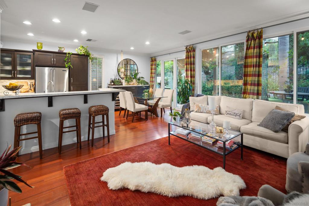 Tucked away on one of the most private lots in the community, this stunning Plan 4 home—the largest floor plan in Stratford Place—offers the perfect blend of space, comfort, and style. Located on a serene back corner with mature landscaping, the outdoor setting feels like your own personal retreat. Ideal for entertaining, the beautifully remodeled chef’s kitchen features stylish cabinetry, luxurious marble countertops, island seating, a Viking stainless steel range, and a KitchenAid wine fridge. Downstairs, elegant engineered hardwood floors add warmth and sophistication throughout the main living areas. This versatile layout includes 3 bedrooms, one of which features a tranquil balcony off the primary suite, plus a spacious loft—perfect for a home office, gym, or playroom. The private backyard is built for year-round enjoyment with a built-in barbecue and a peaceful side yard. With a 2-car attached garage, a coveted driveway parking space, and arguably one of the best, most secluded locations in the neighborhood, this home checks all the boxes for comfort, style, and convenience. Stonecrest Village is a beautifully planned 318-acre community tucked away just off Aero Drive, conveniently located near the I-15—just north of Mission Valley’s premier shopping, dining, and the new Snapdragon Stadium. This central location puts you minutes from downtown San Diego, the beach, and major employment hubs, making it ideal for those seeking both convenience and tranquility. Stonecrest Village is made up of six unique subdivisions, each nestled along tree-lined streets and surrounding an exclusive, lush community park. Residents enjoy access to an award-winning, resort-style clubhouse featuring a junior Olympic-size lap pool, spa, lighted tennis and pickleball courts, a tot lot, picnic areas, and a media room with a library. A second pool and spa facility, along with scenic trails for walking, jogging, and biking, make it easy to stay active and connected with nature. Best of all, Stonecrest Village offers all of this with no Mello-Roos taxes—a rare find in San Diego. With its strong sense of community, top-notch amenities, and unbeatable location, Stonecrest Village is one of the most sought-after neighborhoods in the area.