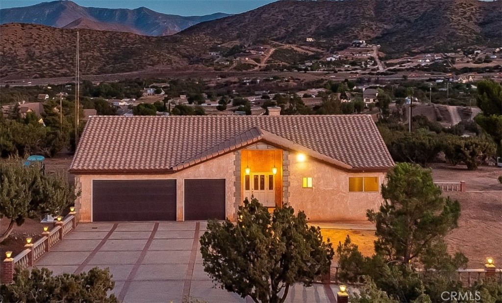 Welcome to 34954 Juniper Valley Rd! This home is a custom built home that was very well planned, showcasing the wonderful 360 degree views in every direction. The large deck overlooks the valley offering privacy and tranquility. This home sits on 4.7 acres offering 2542 square feet of living space, 4 Bedrooms and 2 and a half Bathrooms. The spacious Kitchen has recently upgraded countertops and newer stainless steel appliances. The double oven and ample counter space make entertaining easy! The Dining Room, Living Room and Primary Bedroom include large French Doors overlooking the Deck. The large Laundry Room leads out to the 3 car garage. The home has a whole house Generator that was installed in 2025. There are a total of 6 fire hydrants on the property. The pump house is a custom build made from concrete from the roof to the floor. Come and take a look at this property before its gone!