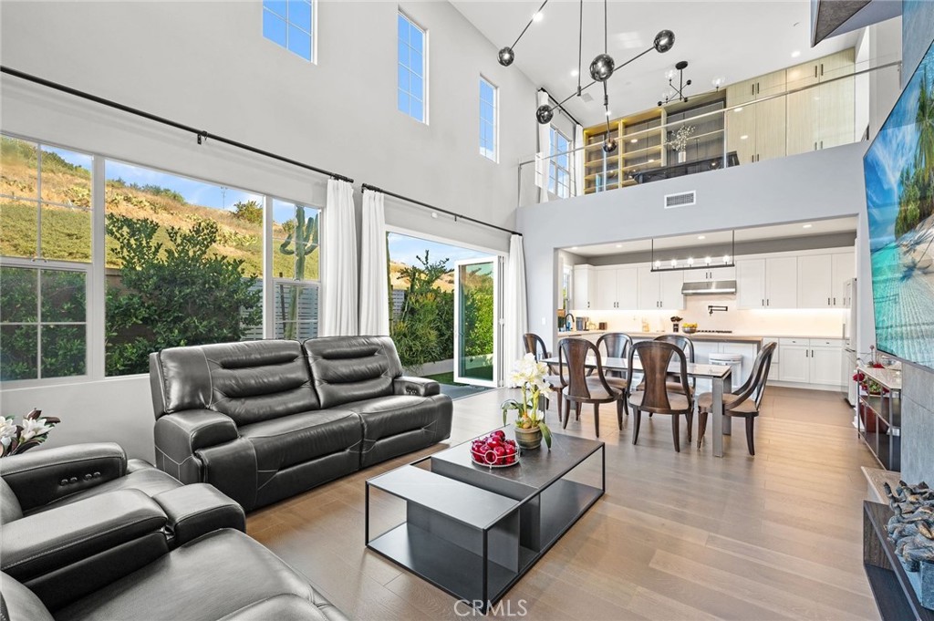 This is your dream house , located high privacy corner. As the crown jewel of the Talise community in the Portola Springs Village of Irvine, this Talise Plan 4 detached residence was built by California Pacific Homes in 2019. This fully upgraded home with spectacular high ceilings features 4 spacious bedrooms and 3.5 bathrooms with a large upstairs loft overlooking the downstairs living area and 2,119sf of living space. Double master room one upstairs and another one downstairs. Near 260K upgraded.Solar was paid off. outdoor booking island, koi pound, gas-fire pit, built -in wine cooler, garage cabinet, on-wall tile, built-in shelf for loft, built-in closet for a whole room and so on. As you enter you will see the beautifully upgraded premium vinyl floors, high ceilings, stunning light fixtures, and open floor plan. This home features an open kitchen with an abundance of counter and cabinet space, stainless steel appliances, kitchen island, recessed lights, and tons of windows to let in the natural light. The main floor bedroom has an en-suite bathroom and is perfect for a guest bedroom or office. Upstairs you will find 3 additional bedrooms, including the primary suite which has breathtaking views, and a large loft. Entertain in the great room and enjoy indoor-outdoor living via the folding panel doors which create an enchanting living experience in the spacious, private yard. Located within short walk from Round Canyon private Park with Community Pool, Tot Lot, Portola Springs Community Center with sport and tennis courts. Shopping/dinning are conveniently located at nearby Woodbury Town Center, Irvine Spectrum, and Great Park. Zoned to award winning Irvine School District and located within short walk to the recently built Loma Ridge Elementary School.