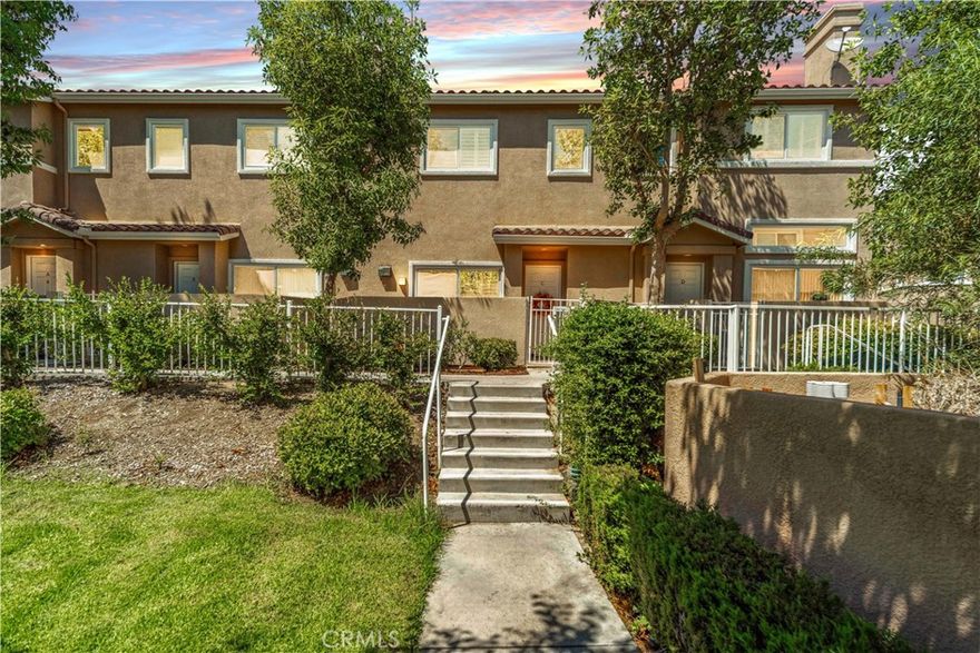 Fantastic, Turnkey 3 Bed 3 Bath Townhome. Located in the highly desirable Stevenson Ranch Community, this beautiful home offers 1,614sqft of living space, 2 car attached garage and a great floorplan. Entering the home, you will enjoy the high ceilings and crisp light of the versatile space perfect for a living room or sitting area, w/gas fireplace and access to the front patio. Moving up a short flight of stairs, you arrive at the mid level of the home that hosts a half bath and wonderful space that overlooks the entry and offers more versatility. From here there are sightlines to the beautifully updated kitchen featuring custom cabinetry w/pantry including pull-out drawers throughout for maximum convenience and LED recessed lighting seen throughout the home. The kitchen also offers stainless steel appliances, new ceiling fans & updated light switches w/dimmers. The kitchen is open to yet another sizable space, perfect for a family room or dining area. Proceeding to the top floor you will enjoy a large window that provides beautiful natural light on the open, airy staircase. Your first stop will be the generously sized primary suite that offers a bath with a dual sink vanity, separate shower area and a walk-in closet. Rounding out the upstairs are the remaining two, well appointed bedrooms and shared third bath. Also notable about this home is the newly (2024) upgraded HVAC system w/nest thermostat. Outside the home, you will enjoy the luscious landscaping and the view from your door of the beautiful greenbelt area that leads to the large community pool and spa area. This community also offers 3 community pools & spas, picnic areas, 2 playgrounds & 1/2 basketball court. The community HOA also covers water & trash for a very low monthly fee and NO MELLO ROOS! Come see this beautiful home and envision your Stevenson Ranch life, situated near excellent award-winning schools, parks, and easy access to freeways for commuters, minutes away to the offerings in Santa Clarita.  Warrantable Loans Are Available for this Complex.