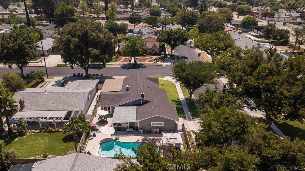 BEAUTIFUL WEST HILLS POOL HOME situated on a huge corner lot 8,000 sqft. lot on a quiet, tree-lined street. Solar system with two back-up batteries by tesla, fenced all around. Amenities include new combo AC unit, hardwood flooring throughout, crown-moldings throughout, a formal living room with fireplace, large kitchen with custom made cabinets and island, enclosed, air-conditioned bonus sun room with custom glass all around. The ENTERTAINER'S BACKYARD is perfect for hosting large groups of family & friends featuring a sparkling pool, large grassy area for the kids & pets to play, offering shade & privacy. In a GREAT SCHOOL DISTRICT and walking distance to parks, great shopping, fine dining & entertainment. Priced to sell… THIS TERRIFIC PROPERTY WILL SELL QUICKLY!!