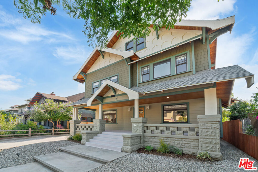 Located in the heart of the historic Harvard Heights HPOZ, this fully updated tri-level 4,120 sqft residence blends timeless architectural charm with modern luxury. Featuring 5 spacious bedrooms with 4.5 bathrooms, the home offers an ideal open floor plan for both comfortable living and entertaining.Step inside to soaring ceilings, abundant natural light, and beautifully restored period details throughout. The chef's kitchen is outfitted with high-end appliances, custom cabinetry, and designer finishes, opening seamlessly to dining and living areas. Each bedroom is generously sized, with the primary suite boasting a spa-like bath and walk-in closet.Plus a bonus room above the detached 2-car garage provides flexibility as a home office, gym, or guest space. Nice backyard space that features a pool and spa. This home is equipped with an updated systems, central HVAC, and carefully curated upgrades ensure modern comfort while honoring the home's historic character.Set on a tree-lined street, this residence offers excellent proximity to Koreatown, Hancock Park, and DTLA. A rare opportunity to own a move-in ready, expansive home in one of Los Angeles' most desirable historic neighborhoods.