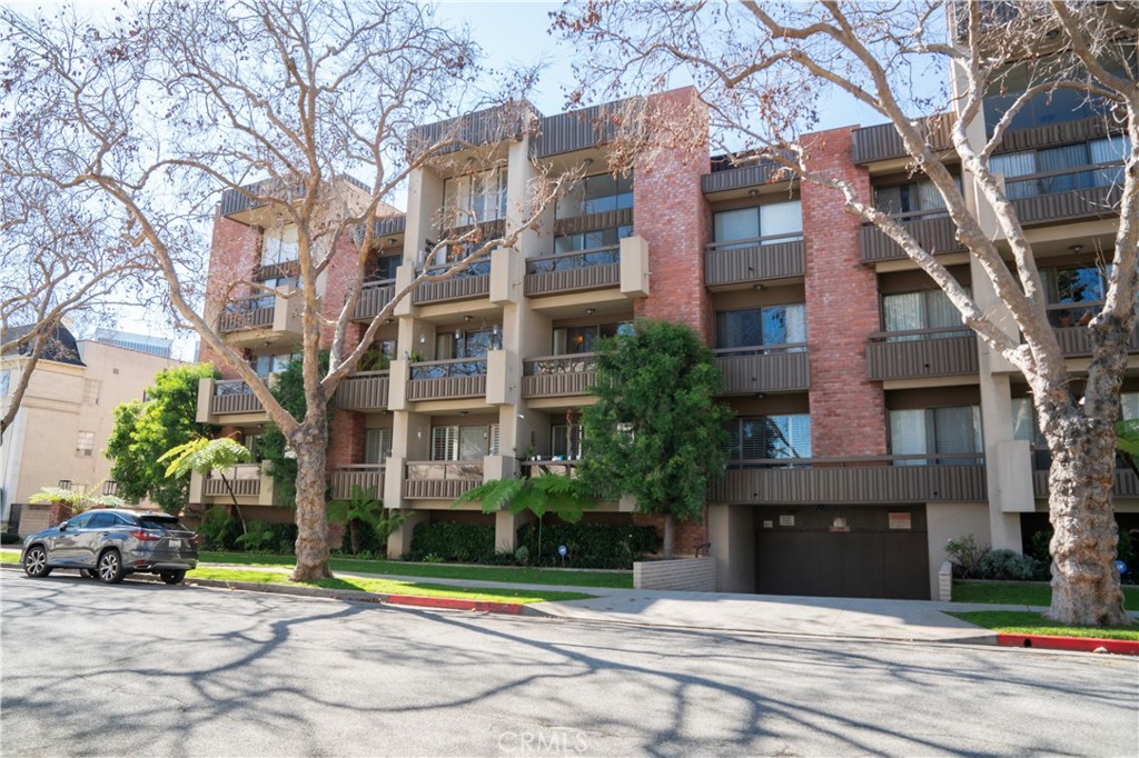 Experience the finest Beverly Hills living in this exquisitely upgraded entertainer's delight. Located alongside the famous Golden Triangle and a short walking distance to Rodeo Drive and Beverly Hills Highschool this stunning 2-bedroom 2-bathroom condo captures every essence of Beverly Hills living. As you enter this beautiful home you are greeted by the contemporary ceramic tile floors in matte tones combined with the light and bright tones of oak hardwood floors that flow seamlessly throughout living areas. Very bright living room with a gorgeous fireplace overlooks picturesque treelined street. The gourmet kitchen with modern cabinetry and quartz countertops with sleek lines along with stainless-steel appliances will appeal to the most discerning chef. Adjacent to the airy and bright living room you will find the very spacious dining room for gatherings with friends and family. Master bedroom features an oversized ensuite bathroom with a step-in shower, a large walk-in closet and a private balcony with the views of a tree lined quaint street. Located on the opposite side of the master bedroom is the very spacious guest bedroom with oversized windows that exude the natural light. This immaculately maintained building features private gated entrance and two assigned parking spaces and a resort style pool.