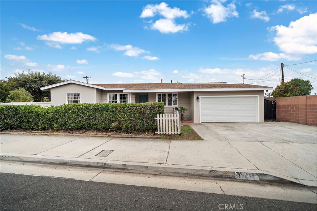 Absolutely unique and truly one-of-a-kind! This sprawling 1,572 sq. ft. single-level ranch-style pool home sits on an expansive 8,848 sq. ft. lot — ideal for adding an ADU or creating RV/boat storage. Featuring 4 bedrooms and 2.5 bathrooms, this beautifully expanded home is filled with thoughtful upgrades, including luxury vinyl wood flooring throughout, dual-pane windows and sliders, and remodeled kitchen and bathrooms. From the moment you arrive, the fantastic curb appeal will catch your eye — with fresh exterior paint, mature shrubs for privacy, a wide concrete driveway, and a welcoming covered front porch. Step inside to a spacious open-concept living and dining area, seamlessly flowing through French doors to your backyard oasis. The entertainer’s dream backyard truly steals the show — complete with a sparkling pool, covered patio, and multiple fruit trees including moringa, passion fruit, avocado, Asian pear, fig, pomegranate, persimmon, and mulberry. Whether relaxing, entertaining, or planning a future ADU with a separate driveway, this space is a private retreat designed for California living at its finest. Back inside, the remodeled kitchen features quartz countertops and backsplash, a breakfast bar, 5-burner gas range, and a large stainless steel farmhouse sink. All four bedrooms are generously sized with ceilings fans, including a primary suite with a cozy fireplace, sitting area, and direct backyard access. The primary bathroom offers a walk-in shower with floor-to-ceiling tile, while the secondary bath includes a tub/shower combo. Additional highlights include a 220V EV charger, upgraded 250-amp electrical panel, tasteful designer paint, recessed lighting and direct-access to two-car garage. Ideally located near Garden Grove Sports & Recreation Center, Atlantis Park, The Promenade Plaza, SteelCraft, Historic Main Street, Little Saigon, and Garden Grove Main Library — plus just 5 miles to Disneyland and 10 miles to Orange County’s iconic beaches — this home offers the very best of Southern California living. Don’t miss this rare opportunity!