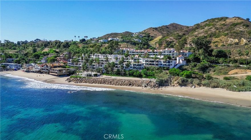 There is nothing like this on the market!

Why buy in Malibu if you aren’t centrally located on the ocean side of PCH, able to wiggle your toes in the sand of a private beach as well as enjoy stunning ocean views and sunsets from the comfort of your home.



This particular condo and the Tivoli Cove Community offer everything you could imagine…and then some.



A211 is the largest model in the complex and it’s on the second level, so there is no one above you. The vaulted ceilings and walls of glass enhance the spacious effect and beautifully frame the spectacular views. This chic two-bedroom, two-bath condo includes a gourmet kitchen with modern appliances and an abundance of storage space. There is a breakfast bar as well as a dining area. The floor-to-ceiling fireplace in this open concept layout helps create a dramatic but still cozy atmosphere throughout the space. You can BBQ or just sit and sip while taking in the views of the coastline from the double balcony.



In addition to the first level bedroom and bathroom, the suite on the second level is currently able to sleep up to 6 people and also function as an office - making it an incredibly useful space. Both first and second level bathrooms have been tastefully renovated and include double sinks.



As an added bonus, this condo includes one of the few storage units. This one is located close to the sand for easy access to your beach chairs and surf/paddleboards.



You’ll be amazed at the resort-style ammenities of this community such as a heated pool, jacuzzi, clubhouse, gym, men’s and women’s saunas, and two tennis courts. On the private upper beach, you’ll find BBQs, picnic tables as well as a sand volleyball court. Latigo Beach offers superb surfing without the crowds of other spots in Malibu.Tivoli Cove is a very secure, guard-gated community. A211 comes with two covered parking places. The complex also offers guest parking.



For added convenience, elevators throughout the complex make it easy to get around as well as down to the beach. There are also on-site laundry facilities on most levels.



A211 is available partially or fully furnished (including kitchen essentials), so you can move right in. You can’t beat this rare opportunity to enjoy your own dream beach escape or you can make it available to others as a desirable rental property!