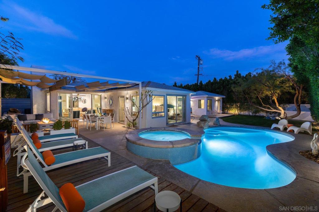 Voted "Guest Favorite" on Airbnb, this highly lucrative Racquet Club West vacation rental is turnkey and offered fully furnished with over $100,000 in upgrades and consistent track record of vacation rental history. Per City of Palm Springs, this home is eligible for a new STVR permit. A lush, art-filled oasis on the westside of the historic Racquet Club, just minutes from downtown Palm Springs and the Tram, the open, airy floor plan of the main house showcases playful, colorful, mid-century design. All bedrooms enjoy direct access to a shaded lounge area, saltwater pool, spa, fire pit, game area, and stunning San Jacinto mountain views. The separate, tropical-themed casita has an ensuite bath, large wood patio, and is perfect for some extra privacy from main house. Recent upgrades include newer smooth pebble-tec pool coating & pool equipment, custom Ipe wood decks, custom pergola, landscaping & irrigation, and smart home controls (pool, thermostat & locks). Privacy abounds as there are no neighbors on the back (South side) of the property and the large, serene yard is yours to relax and enjoy the sun and mountain views. Soak up the sun from the baja shelf or take a dip in the saltwater pool. The covered patio has outdoor dining for 6 and a built-in gas BBQ grill, with custom shade structure. Lounge seating on the raised Ipe wood deck surrounds a modern gas firepit & seats 7+, and there are multiple chaises for relaxing by the pool. The shaded game courtyard includes ping pong and additional lounge seating, and lighting for night-time play. The living room has a gas fireplace, 58" Roku smart TV, plenty of board games, an oversized sofa, and large sliding doors that not only allow easy access to the pool – but also let in abundant natural light. The modern kitchen, with stainless appliances and quartz counters, is fully stocked with everything you could possibly need to cook and serve meals including a breakfast bar and adjacent dining area. THE POOLSIDE ROOM - Adjacent to pool, spa & cabana with mountain views. Large sliding doors & lots of natural light. King bed & walk-in closet. 43" Roku smart TV. Memory foam mattress & luxury bedding. CASITA TROPICALE - Private suite with separate locked entrance and exclusive Ipe wood patio w/seating & views of the mountains. Ensuite restroom. King bed with memory foam top. Lounge area with large sofa, laptop table and reading lamp. 43" Roku smart TV. Armoire for storage. THE AGATE ROOM - Central to the home & adjacent to outdoor game courtyard & pool. Queen bed with memory foam mattress & luxury bedding. Large dresser. 50" Roku smartTV. THE GARDEN VIEW ROOM - Large, private suite with personal restroom and access to outdoor game and pool area. Views of front garden. Queen bed with memory foam mattress & luxury bedding, 50" Roku smart TV. Armoire for storage. The Racquet Club West neighborhood is one of Palm Springs’ most iconic areas, blending mid-century modern architecture with a laid-back desert lifestyle. Known for its rich history and proximity to downtown Palm Springs, it offers easy access to the city’s best dining, shopping, and entertainment. Past booking revenue reports available upon request, This home has solar power (Sunrun).