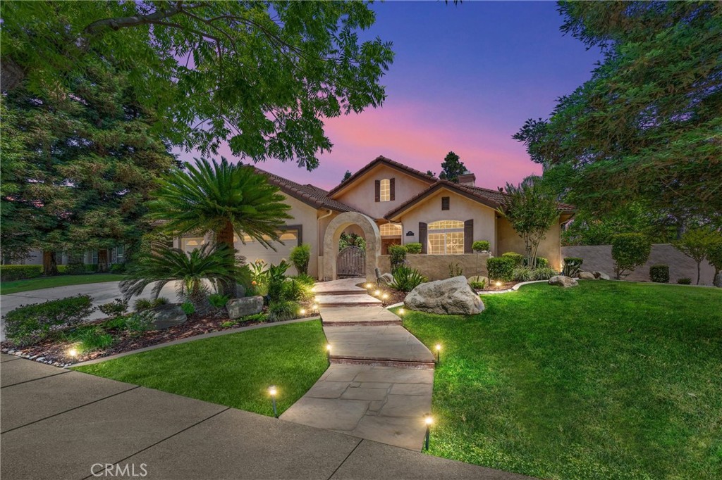 Welcome to refined living in Grand Island at Seven Oaks, a premier gated enclave in one of Bakersfield's most distinguished communities. This beautifully appointed corner-lot residence features 4 spacious bedrooms and 3 full bathrooms, including a serene primary suite and a private junior suite complete with an ensuite bath and custom kitchenetteperfect for guests or extended stays. The backyard is a resort-inspired sanctuary, offering a sparkling pebble tec pool with a cascading rock waterfall, stately palms, lush gardens, and multiple tranquil seating areas. A grand palapa with built-in grill, bar, and prep space sets the stage for elegant outdoor entertaining, while the inviting front porch and covered patio add timeless charm. Seamlessly blending sophistication and comfort, this home is nestled within proximity to top-rated schools, fine dining, and upscale amenities. A rare opportunity to own a residence of this calibermake it yours.