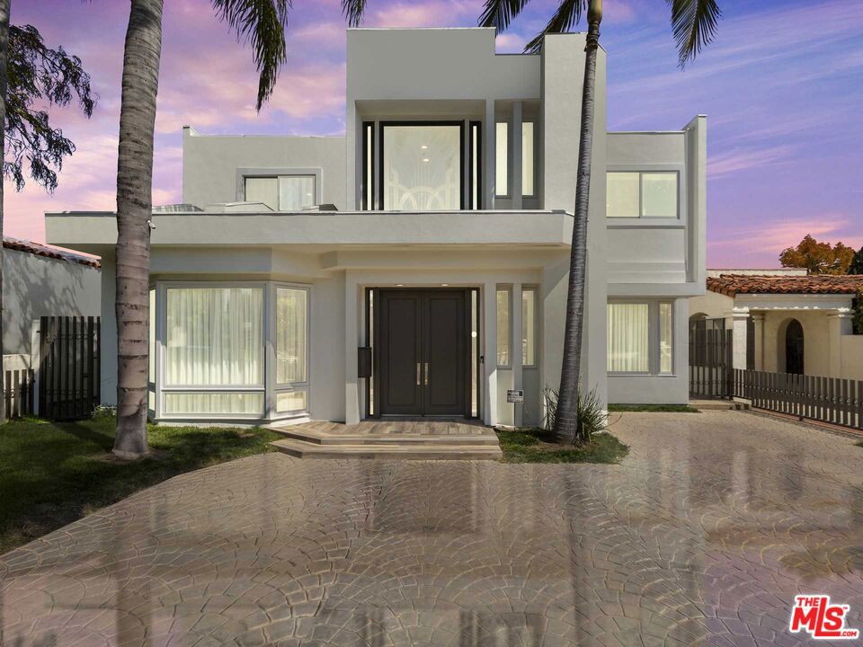 Welcome to the luxurious Beverly Hills lifestyle! Located in the heart of the 90210 zip code, this grandeur and pure elegance home is accessible to the world-renowned shopping, dining, and famous Rodeo Drive. Recently remodeled with brand new floors, bathrooms and windows, showcasing a contemporary, warm modern open style floorplan and aesthetic. Upon entry, you are greeted with high ceilings throughout, sky lights, and a grand foyer leading to an impressive living room, that flows into a family room with a full bar. The culinary kitchen has custom cabinetry, quartz countertops, Wolf commercial grade 8-burner stove, and French door side-by side Subzero refrigerator and freezer. The spacious breakfast area overlooks the lush backyard and pool, providing a serene setting. A grand staircase leads to the upstairs primary suite, a peaceful sanctuary, complete with 2 walk-in closets and a balcony overlooking the backyard and pool. The second floor boasts three additional guest bedrooms one of which is en-suite and two others that share a dual bathroom, all with walk in closets. Residents of the property can utilize all of Beverly Hills School District. This bright and spacious masterpiece offers an unparalleled living experience in one of the most desirable locations in Beverly Hills. Staging in photos is virtual.