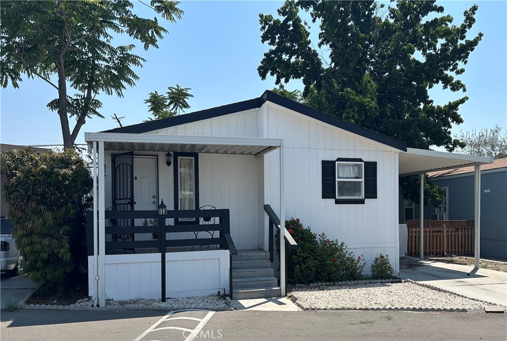 BEAUTIFUL "ALL AGE" THREE BEDROOM HOME IN A GATED COMMUNITY! Welcome to Mirage Estates! This nice home has drywall and upgraded laminate flooring along with stainless steel appliances in the kitchen! It is conveniently located just a short walk away from the clubhouse, pool and play ground.