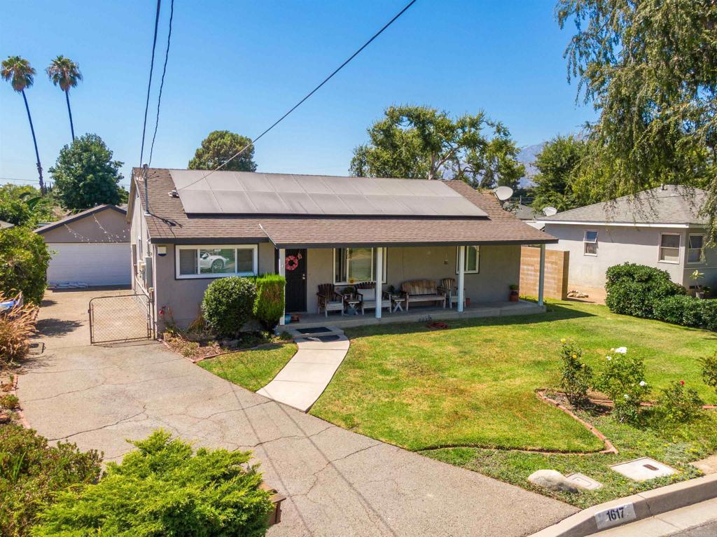 Welcome to 1617 Fairdale Ave – a charming and well-maintained single-story home situated on a generous ~6,559 sq ft lot. This delightful 3-bedroom, 1-bath residence offers approximately 1,113 sq ft of comfortable living space, perfect for first-time buyers, downsizers, or anyone seeking a move-in ready home with character and functionality. Originally built in 1949, the home showcases true pride of ownership, with thoughtful updates and beautifully landscaped front and backyards. The property includes owned solar panels with an assumable agreement, helping to keep energy costs low. Each room in the main house is equipped with portable air-conditioning units, providing flexible and efficient cooling throughout the warmer months. A detached 2-car garage sits at the rear of the property, complete with a versatile bonus room—perfect for a home office, gym, studio, or guest space—fully separated from the main home. A 3-car driveway offers ample off-street parking. The outdoor space is a true highlight, featuring a variety of fruit trees including lemon, navel orange, fig, plum, strawberries, and pomegranate, along with colorful roses in the front yard. The expansive backyard is ideal for BBQs, entertaining, and family gatherings, creating a private oasis for relaxation and enjoyment. Conveniently located with easy access to public transportation, grocery stores, and schools, this property offers the perfect blend of comfort, efficiency, and lifestyle. Don’t miss your opportunity to own this lovingly cared-for home in a desirable neighborhood—ready to enjoy from day one! Interior photos coming soon!