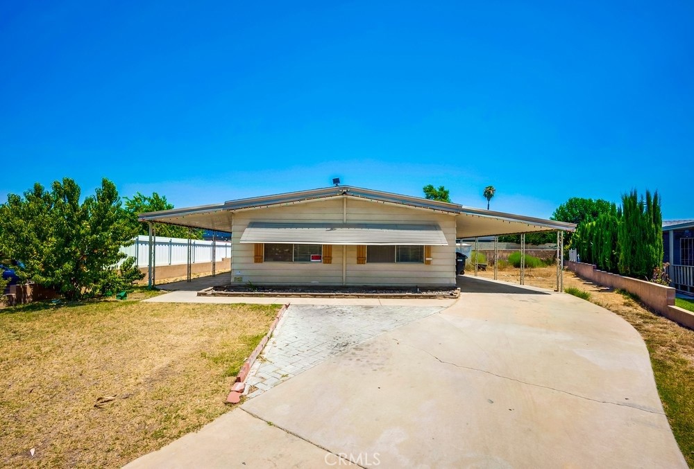 Spacious 2 Bedroom, 2 Bathroom Manufactured Home on Oversized Lot. This home offers a bright, open floorplan with plenty of room to relax and entertain. Featuring granite countertops, sleek laminate flooring, solar, and central air for year-round comfort, it’s move-in ready and full of charm. The oversized lot provides extra outdoor space for gardening, gatherings, or simply enjoying the fresh air. With two generously sized bedrooms, two full bathrooms, and a well-designed layout, you’ll have all the comfort and convenience you need. Financing is available—don’t miss your chance to make this one yours!