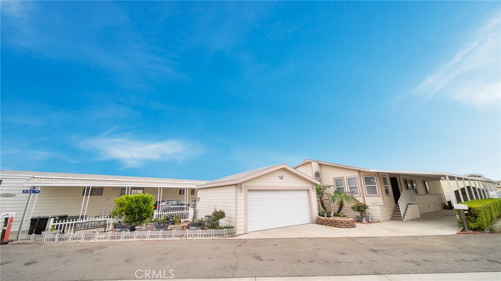 Welcome to your dream manufactured home in the heart of Anaheim, CA! This residence boasts an impressive 1500 square feet of modern living space. Offering a spacious back patio, With ample parking accommodating up to four vehicles, including a convenient two-car garage. Inside the home has been and freshly painted and There is new laminate flooring Throughout the home and the kitchen is well appointed for entertaining! The open floor plan is ideal for families, with the primary suite located at the rear for added privacy. The large family room off the kitchen is perfect for entertaining, while the front living room is perfect for family gatherings!. The master bedroom is located at the back of the home and has its own bathroom with separate tub and shower. The two ample sized guest bedrooms and a full guest bathroom add to the Charm of this home. Located in the desirable Rancho La Paz mobile home park, this all-ages community offers fantastic amenities, including a beautiful community center, game room, ballroom, and a sparkling pool and spa. Pet owners will appreciate the dog-friendly environment with convenient dog stations throughout the park. Don’t miss your chance to make this stunning home your own!
Monthly rent space is $2317.00
The home is to be sold as is.
The Sheds located in the carport will be removed