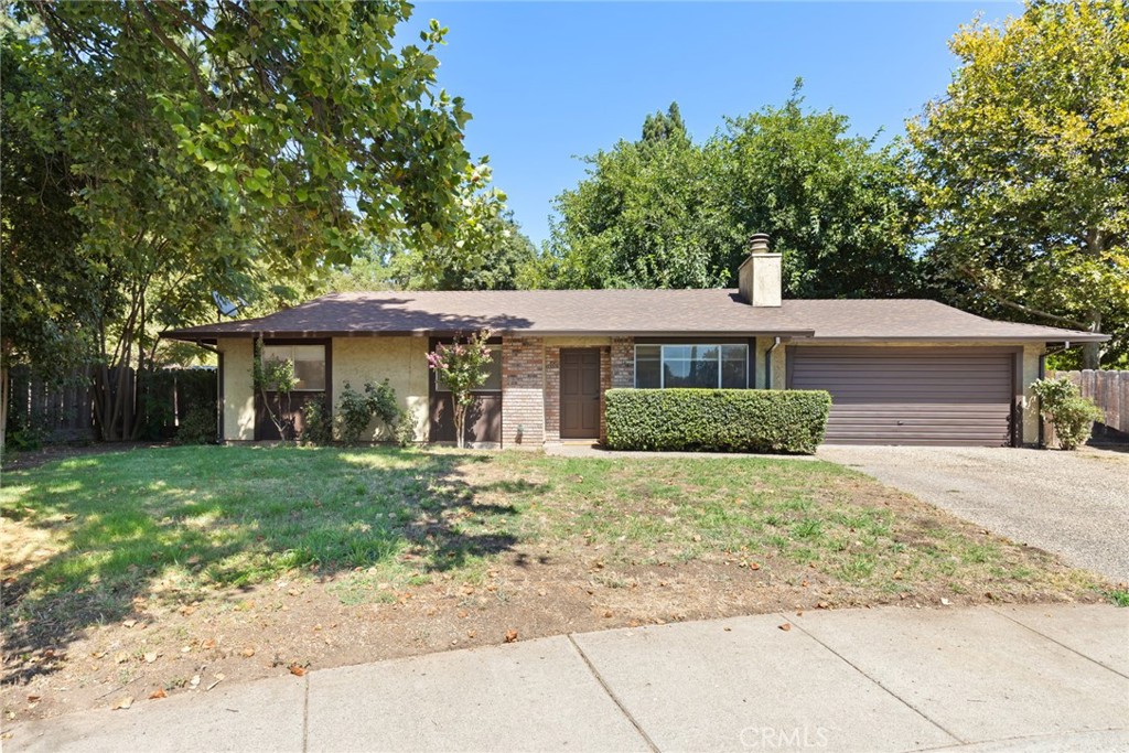 Tucked away at the end of a quiet cul-de-sac in North Chico, this charming 3-bedroom, 2-bathroom home offers style, warmth, and all the features that make everyday living a pleasure. This home already features some thoughtful updates, but there’s still room to bring your own vision and style to life. As you step inside, you’ll be welcomed by an open and inviting atmosphere, highlighted by beautiful flooring, lightly painted walls, and a bright living room anchored by a classic brick fireplace—the perfect centerpiece for gatherings or cozy nights in. The kitchen makes everyday meals a breeze. Featuring ample cabinetry, plenty of counter space, stainless steel appliances, and a smooth electric range, it’s fully equipped to handle all your cooking needs. The adjoining dining area offers a wonderful spot to enjoy family dinners or casual get-togethers with friends. After a long day, retreat to the primary suite where relaxation awaits. This private space includes a generous walk-in closet and an en suite bathroom complete with a roomy vanity and a large walk-in shower. Two additional guest bedrooms provide versatility for family, guests, or even a home office, while ceiling fans throughout ensure comfort all year long. Outside, the expansive backyard sets this property apart from the rest. This blank slate offers room to create your dream outdoor space, the possibilities are endless—design a patio for entertaining, plant a lush garden, have your own chickens, possible mother in law unit, or even put in a pool for summer fun. With its quiet location, quick access to HWY 99, and a long list of desirable features, this home offers everything you’ve been looking for. Don’t miss the opportunity to make it your own!