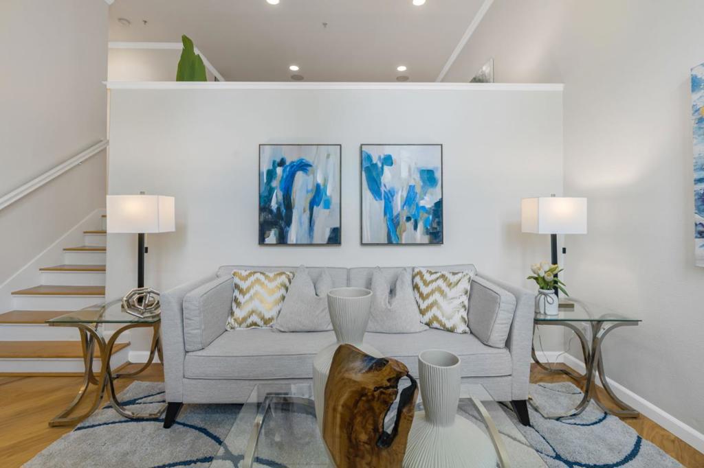 Welcome to this beautifully remodeled townhome located in Communications Hill. Newer built upscale home features high ceilings, a beautiful chef's kitchen with stainless steel appliances, upgrades bathrooms, laminate flooring throughout and tons of natural light. This desirable floor plan offers the urban lifestyle and convenience. Washer & dryer on the upper level. Large master suite with walk-in closet & dual sink vanity. Dual pane windows. 2 car side-by-side garage that includes ample extra storage space. Low HOA fee. Easy access to 87 & 280 freeways, public transportation and just a short distance from Willow Glen and San Jose downtown. Located in close proximity to the popular Plant Shopping Center and many Hi-tech Companies. Don't miss the unique opportunity to call this beautiful townhouse your home!