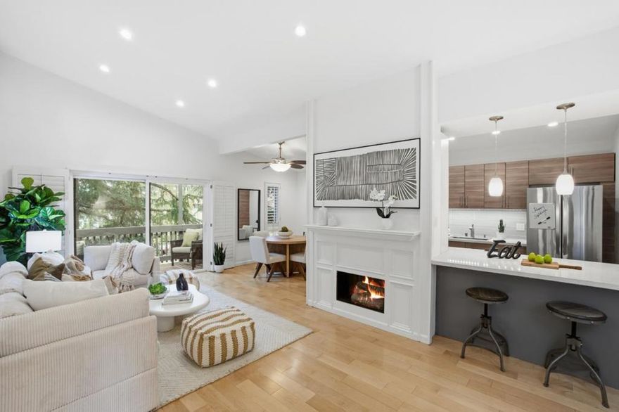 Perched on the top floor of the Lauriedale Community, 4117 George Ave #4 feels like a private retreat above the trees. Sunlight pours through tall windows, illuminating vaulted ceilings and a welcoming living room with beautiful engineering flooring, recessed lighting, a cozy electric fireplace, and plantation shutters that open to a peaceful balcony surrounded by greenery. The dining area blends charm and function with built-in shelving, while the galley kitchen shines with Quartz countertops, tile backsplash, stainless-steel appliances, pantry and pendant lighting over a convenient pass-through bar  perfect for easy entertaining. A tiled hallway leads to the private wing, where the primary bedroom offers engineered hardwood floors, large windows, and a modern frosted-glass closet. A sliding barn door reveals the office/nursery ideal for remote work or quiet creativity. The updated split-bath features a tiled shower-over-tub, linen closet and stylish contemporary vanity. With pool and tennis, gym and clubhouse amenities, lush landscaping, and proximity to Hillsdale Mall, Caltrain, and major highways, this bright top-floor unit is a tranquil escape at the heart of San Mateo. ***SELLER WILL PROVIDE BUYER A PROFESSIONAL LAUNDRY SERVICE FOR 2 YEARS, DOOR TO DOOR THROUGH MULBERRY'S.