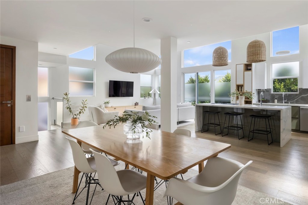 Welcome to 316 North Francisca Avenue, a stunning, light-filled townhome in the heart of South Redondo Beach. Built in 2019, this modern coastal residence offers 3 spacious bedrooms plus a versatile third-floor loft that can easily serve as a fourth en suite bedroom, along with 4 beautifully appointed bathrooms.
Thoughtfully crafted with both style and functionality in mind, the home features smart home capabilities, wide-plank hardwood floors throughout, soaring ceilings, and an open-concept living space ideal for entertaining. The gourmet kitchen boasts top-of-the-line Miele appliances, sleek cabinetry, and a generous center island perfect for gathering.
On the entry level, two ensuite bedrooms open directly to a private backyard retreat, complete with string bistro lights over the dining and lounge areas, perfect for relaxing or hosting friends. Upstairs, the main floor showcases a luxurious primary suite with a custom walk-in closet and spa-like bathroom. A private three-stop elevator connects every level, including the attached two-car garage.
Ideally situated in South Redondo, this home is just a short walk to Redondo Union High School, the pier, Whole Foods, shops, restaurants, and more. Experience modern coastal living at its finest!