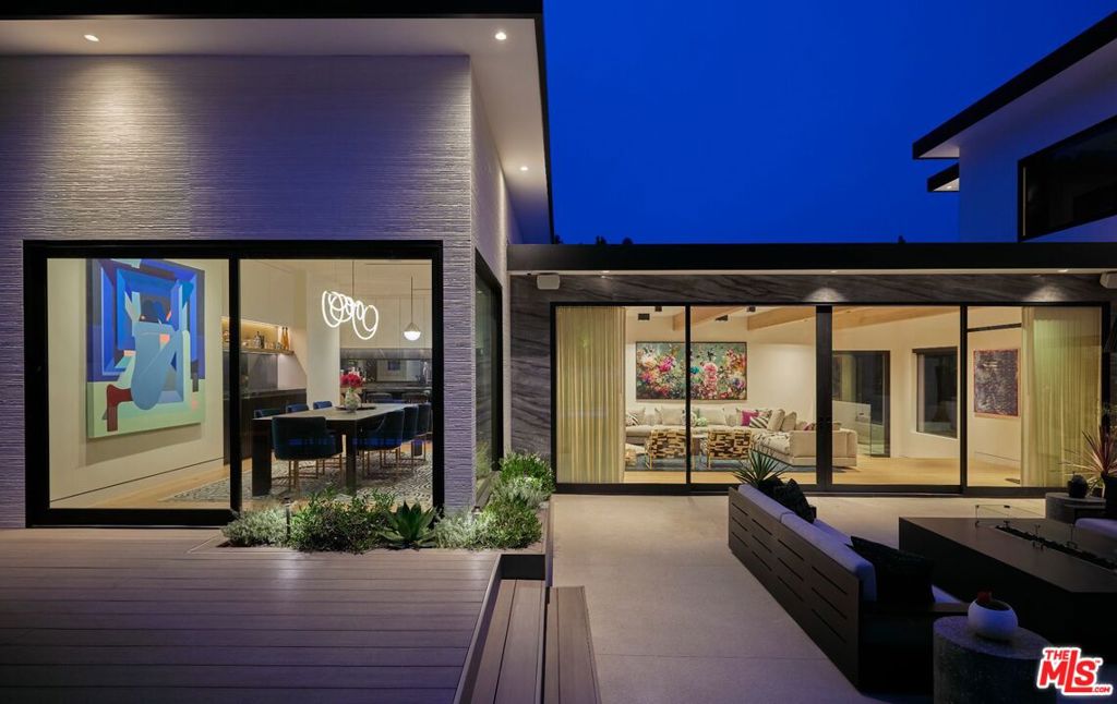 Fully renovated modern home in BHPO on a quiet street in Coldwater Canyon. Just beyond the front door, the formal living room has beamed ceilings and looks out to the backyard. The dining room conveniently blends into the kitchen which features gorgeous black marble counters and high-end appliances. Glass walls throughout the home allow natural light to fill the space and highlights the beautiful finishes and textures throughout the home. The spacious primary suite offers a spa-like bathroom. Oversized sliding doors open for seamless indoor/outdoor living and entertaining. The sparkling pool with oversized spa is surrounded by areas for lounging, a firepit with seating, room for dining al fresco, and lush landscaping. This exquisite home flawlessly combines luxury and tranquility, making it the perfect retreat for sophisticated living and entertaining.