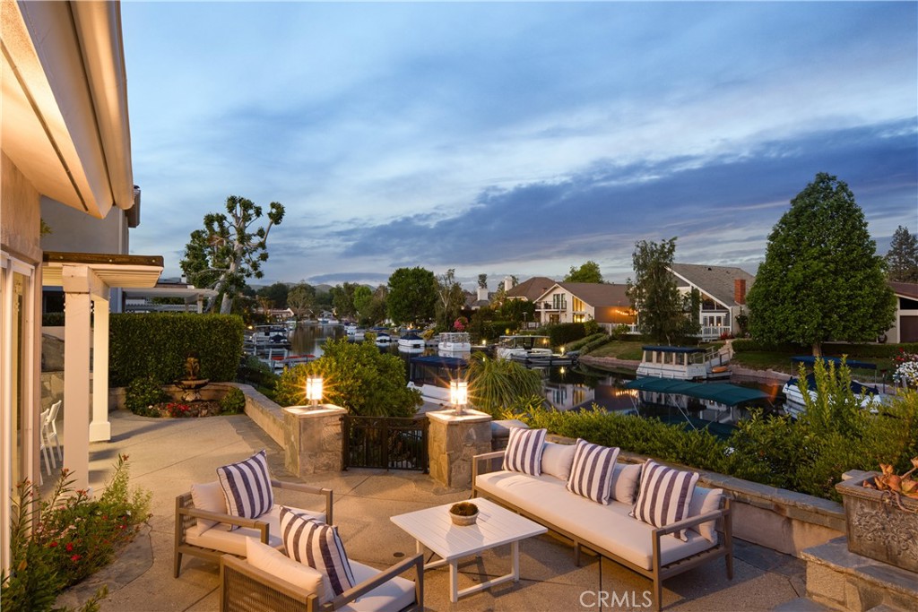 Welcome to a luxurious sanctuary located on the prestigious Westlake Island, an oasis of beauty and sophistication nestled in the heart of Westlake Village. This completely remodeled and updated residence invites you to step inside and be greeted by an abundance of natural light that flows through every room. The home exemplifies seamless indoor-outdoor living, with spaces that effortlessly integrate with the breathtaking outdoor entertaining areas. It boasts five generously-sized bedrooms and five beautifully appointed bathrooms, including a serene primary master suite. The state-of-the-art chefs kitchen features custom cabinetry and opens up to the dining room and your stunning backyard that sits right on the lake. Expansive picture windows throughout the home offer picturesque views of the lake and surrounding mountains, creating a tranquil and elegant living environment. Each oversized bedroom comes with its own en-suite bathroom, while the spa-like primary bathroom offers large closets and luxurious amenities. Step out onto your private dock just steps away from your patio and enjoy a peaceful sunset cruise or a delightful dinner at the nearby landing. Located within a 24-hour guard-gated community on the island, this home promises privacy, security, and an unparalleled lifestyle.