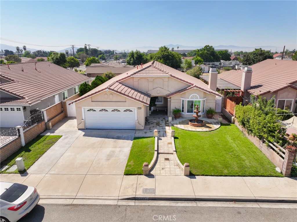Welcome to 13681 Lexus Lane in Fontana, a beautifully upgraded single-story home offering 4 bedrooms and 2 remodeled bathrooms. Inside you’ll find tile flooring throughout the main living areas, laminate flooring in the bedrooms, and a remodeled kitchen with quartz countertops and custom cabinetry. The home features two fireplaces—one in the living room and one in the family room—perfect for cozy nights. Step outside to an enlarged covered patio with tile flooring, surrounded by a spacious backyard complete with mature orange and lemon trees for a touch of nature and charm. Sitting on a generous 7,797 sq. ft. lot with an attached 2-car garage, central AC and heating, this property combines comfort and functionality. Ideally located near Victoria Gardens for shopping, dining, and entertainment, and just minutes from the 15 freeway for an easy commute, this home is the perfect blend of modern upgrades, everyday convenience, and lifestyle living.