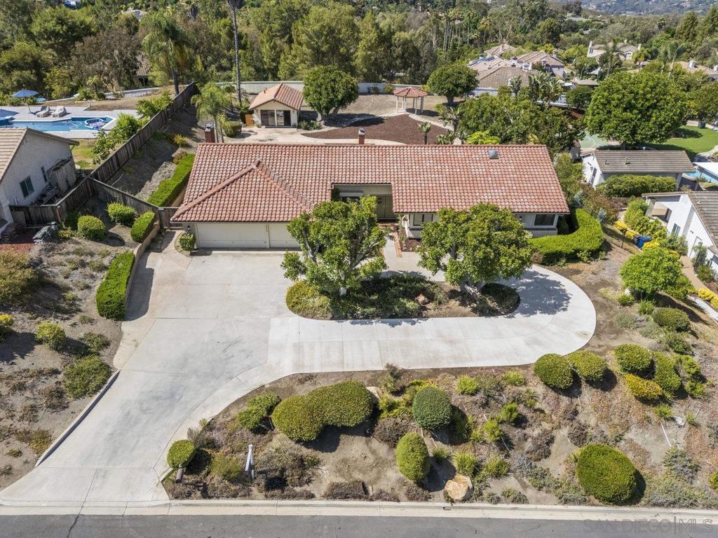 Welcome to Your Newly Refreshed Rancho Verde Retreat! Experience the perfect blend of comfort, and elegance in this beautifully updated single-story home with a detached casita. Offering 4 bedrooms, 4.5 bathrooms, and sweeping views, this spacious property is nestled in the highly desirable Rancho Verde community. Known for its peaceful atmosphere and no HOA or Mello Roos. The main home features 3 bedrooms, 3 full bathrooms, and a convenient half bath across 2,866 sq ft of well-designed living space. Just steps away, the detached 488 sq ft casita offers a private entrance, 1 bedroom, and 1 full bathroom, perfect for hosting guests, accommodating extended family, or creating a private office or studio. Enter through stately double doors into a light-filled open floor plan with high ceilings and inviting charm. The formal living and dining areas are centered around a striking brick double-sided fireplace and framed by large windows that showcase tranquil mountain and sunset views. Fresh updates and tasteful furniture highlight the home’s elegant lines and warm ambiance. The chef’s kitchen is built for entertaining, featuring granite countertops, a spacious breakfast bar, and panoramic views of the beautifully flat backyard through oversized bay windows. Adjacent to the kitchen, a cozy family room with a second fireplace offers the perfect place to gather and relax. The primary suite is a true retreat, complete with an oversized en-suite bathroom, dual walk-in closets, and ample room to unwind in style. Don’t miss your opportunity to own a rare gem in Rancho Verde! Lovingly maintained by the same family for over 25 years, this beautifully updated home blends timeless care with thoughtful, modern upgrades throughout. Nearly every detail has been enhanced to elevate comfort, efficiency, and style, making it truly move-in ready. Main home has two brand-new AC and heating systems, ensuring year-round comfort. The bedrooms were recently outfitted with plush new carpeting, while the guest house also received fresh carpet and a new heating system for added coziness. The kitchen was fully remodeled in 2018, and further upgraded with a double oven and cooktop in 2019, plus a new dishwasher installed in 2024. Flooring enhancements include rich hardwood floors (2018), marble flooring in the half bath (2025), and updated finishes throughout. Bathrooms have also seen recent updates, including new toilets, a fully refinished en-suite bath, and a new vanity installed in the guest house in 2025. Fresh interior paint in both the main home and casita, along with exterior paint on the front façade, patio lattice, and gazebo, add to the clean and refreshed feel. Mechanical and structural updates include a whole-house water heater (2023) and a new water heater in the guest house (2025). The pool and spa area has been transformed with a replastered pool (2024), new pool pump (2024), and new pool heater (2025). A lift-and-relay with new underlayment (2024) ensures lasting durability, and the spa exterior was refinished with fresh stucco and paint, giving the backyard oasis a polished look. Step outside into your own private retreat. The expansive backyard features a sparkling pool, separate spa, mature landscaping, and a pergola perfect for morning coffee or sunset relaxation. Whether entertaining or enjoying quiet moments, this outdoor space offers comfort and serenity year-round. Additional highlights include a spacious circular driveway and a location in one of the area's most desirable neighborhoods. With recent improvements, and pride of ownership evident throughout, this home delivers the ideal Southern California lifestyle, ready for its next chapter.